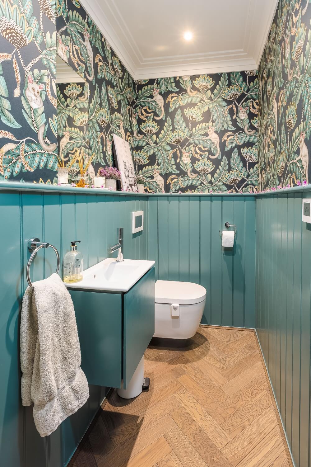 herringbone floors in a small cloakroom