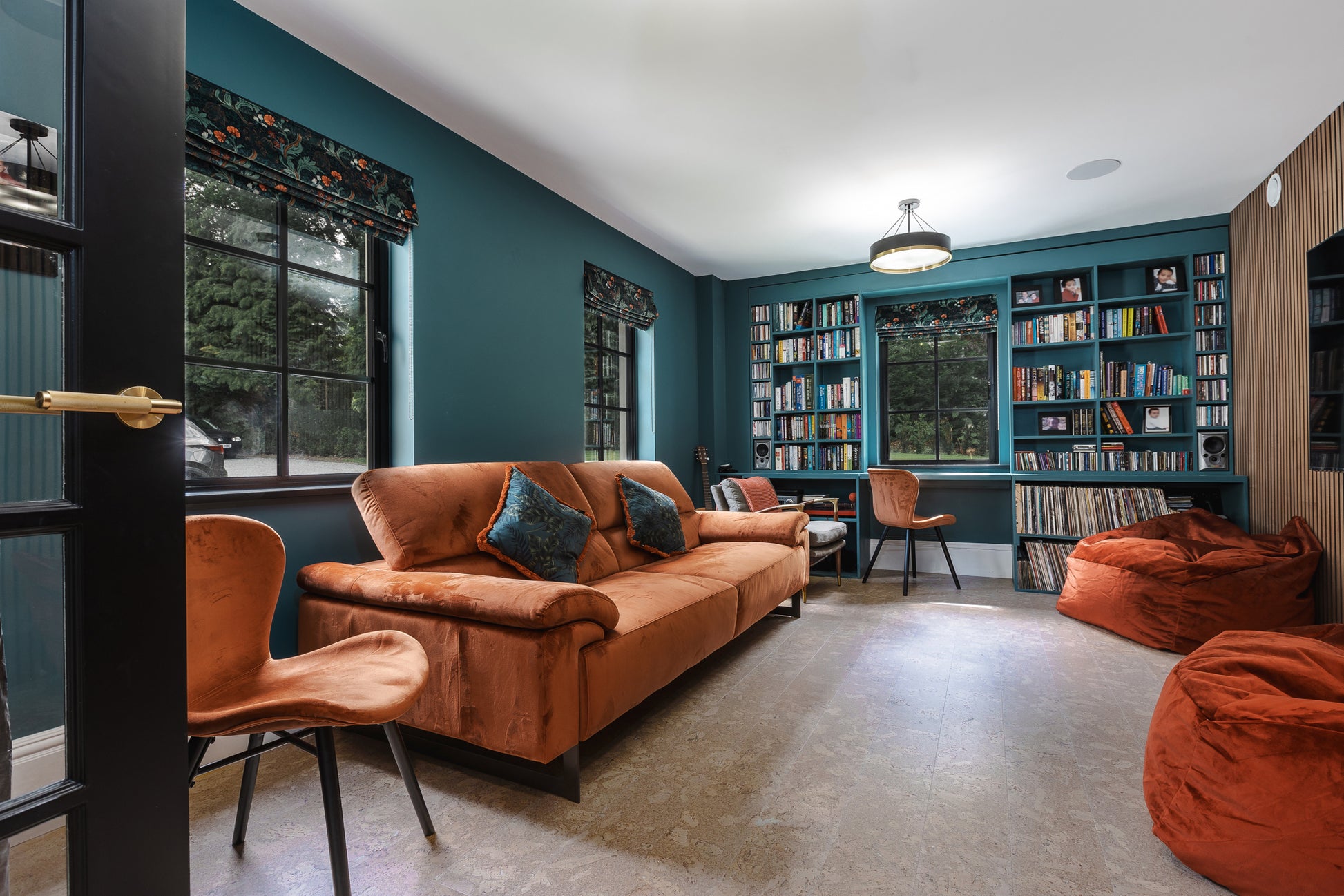arito cork floors in a living space with orange sofa and green walls