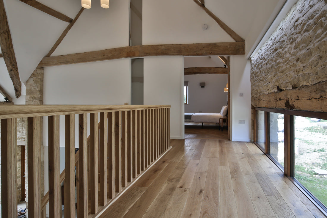 cotswold barn conversion with engineered oak wood flooring and wood beams