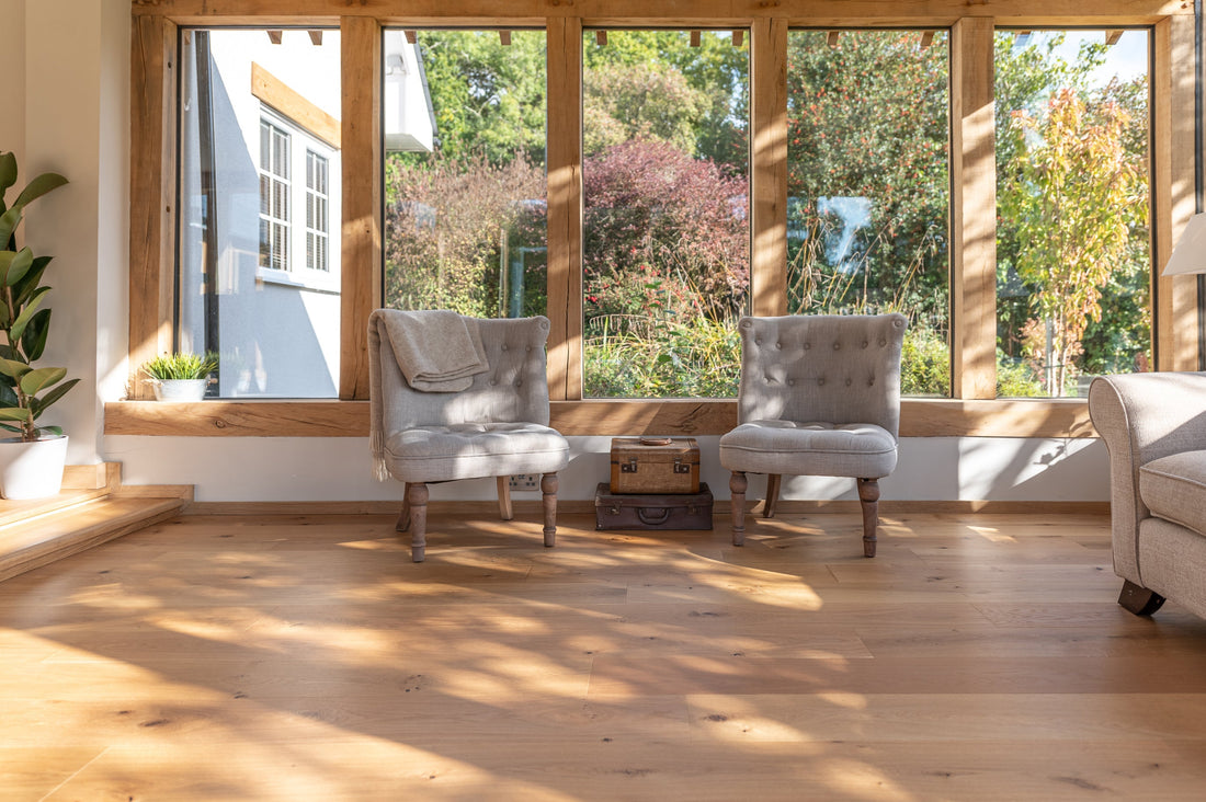 bright sun room with wooden window frames and natural oak wood flooring