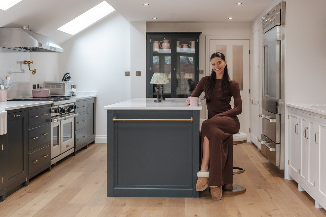 emily canham inside her green kitchen with smoked white oak wood floors
