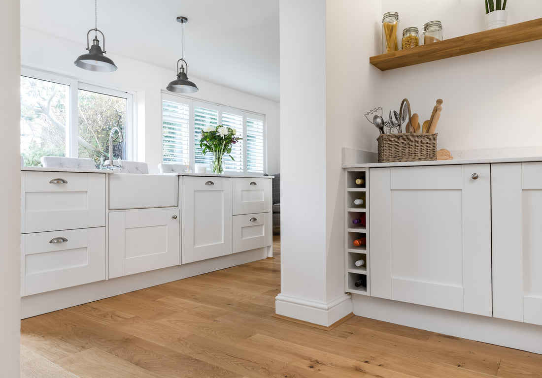 oiled oak flooring in white kitchen design