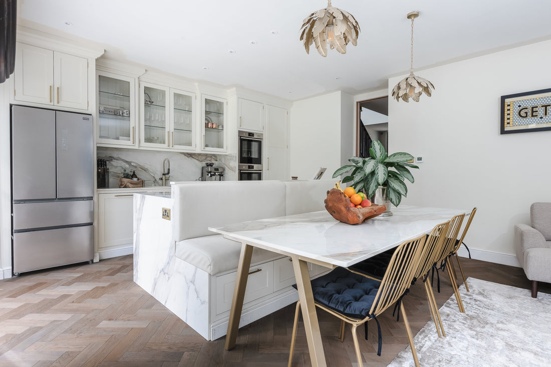 modern dining table in open plan kitchen with frozen umber herringbone floors