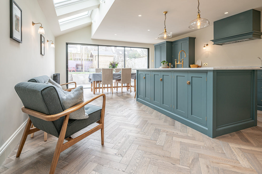 light filled kitchen extension with blue island and frozen umber herringone