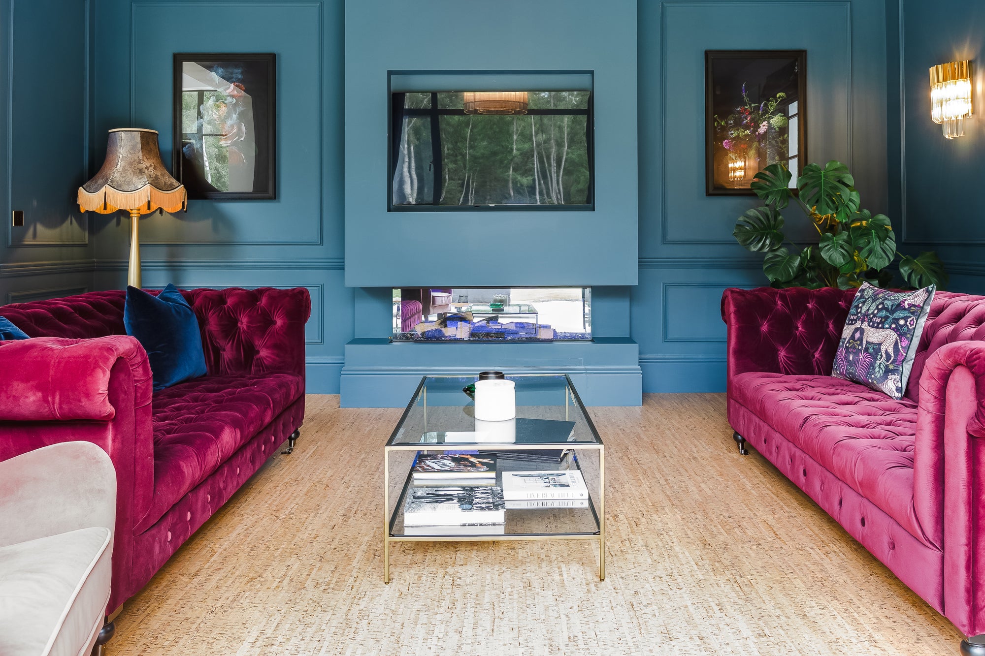 Amarela cork floors in a living room with bright pink sofas and blue walls