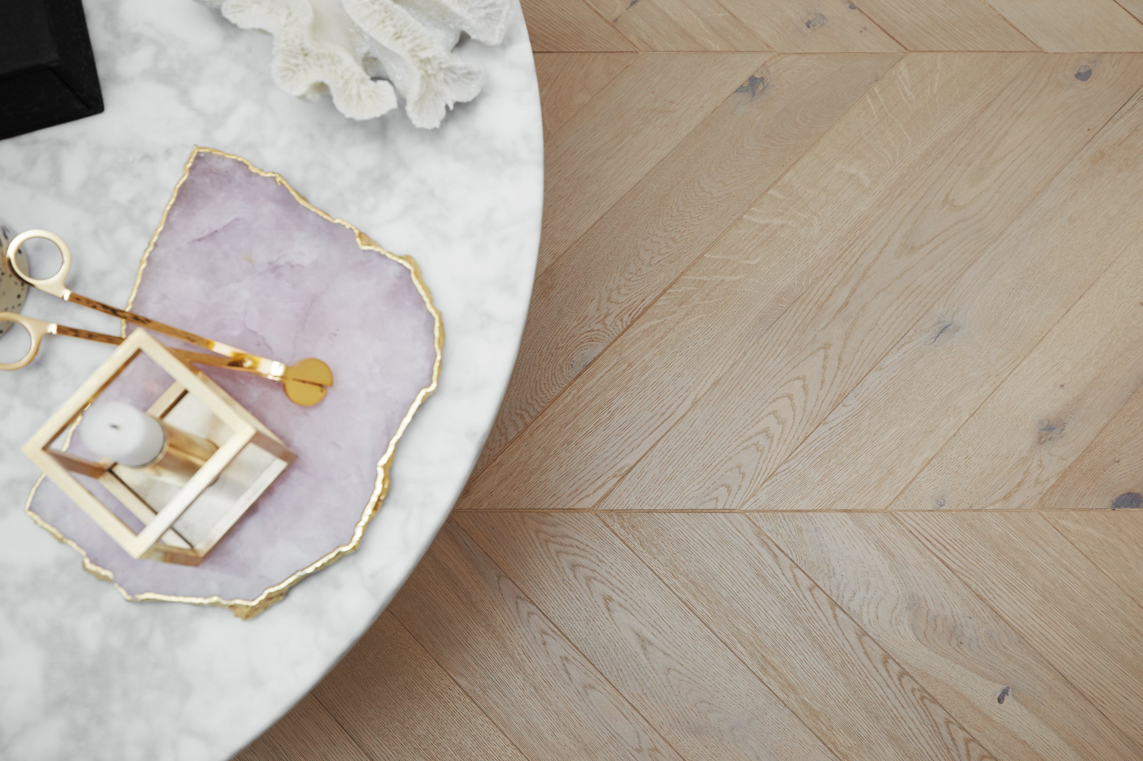 A chevron parquet wood floor