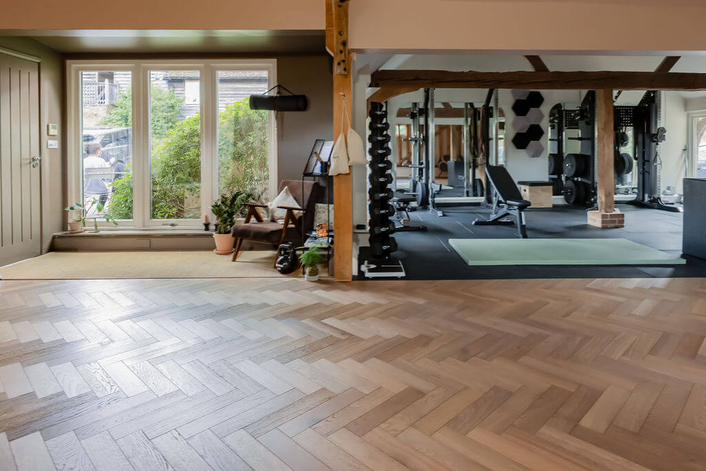 Herringbone wood floors in gym design