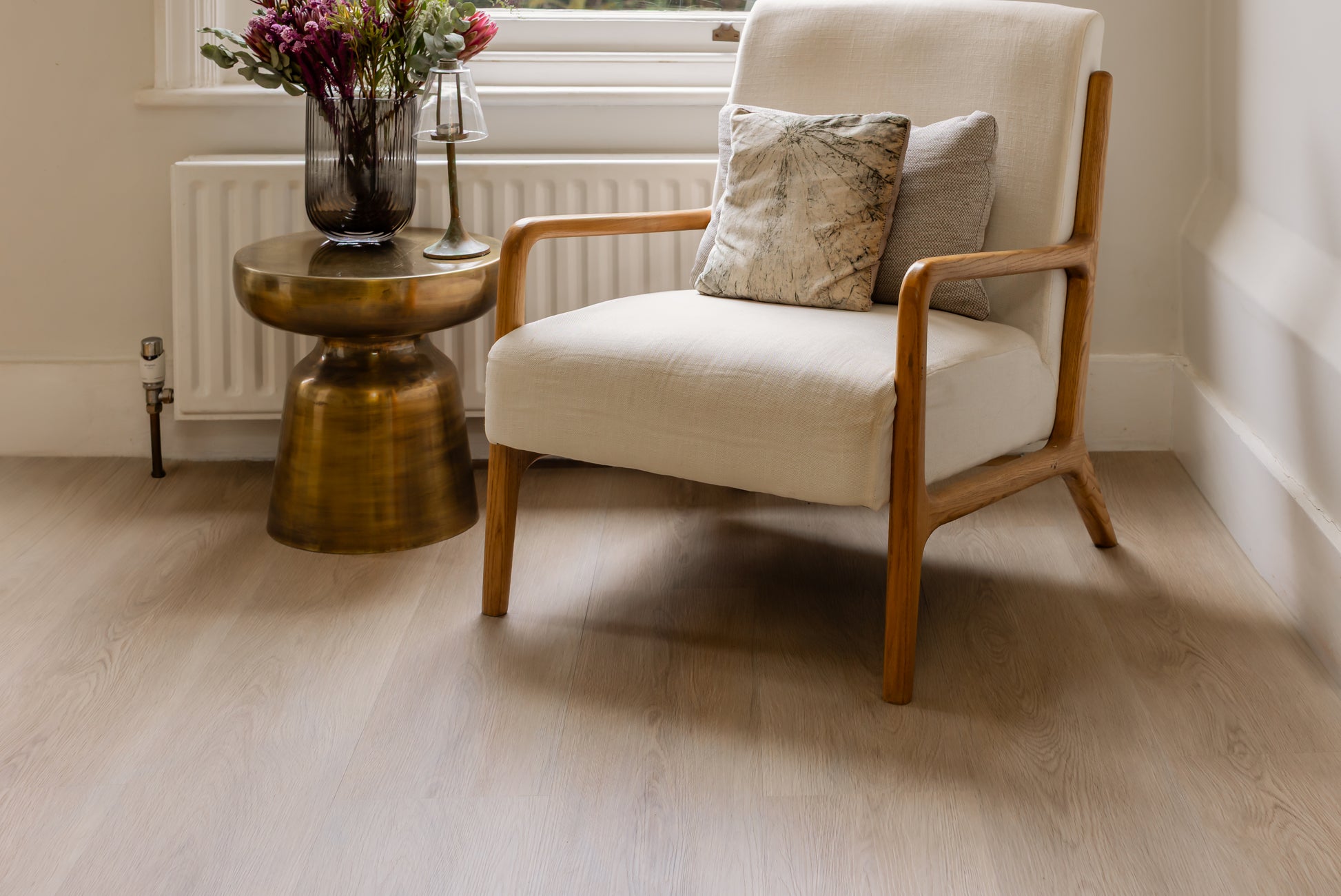 Warm and earthy brown click vinyl floors in a living room setting