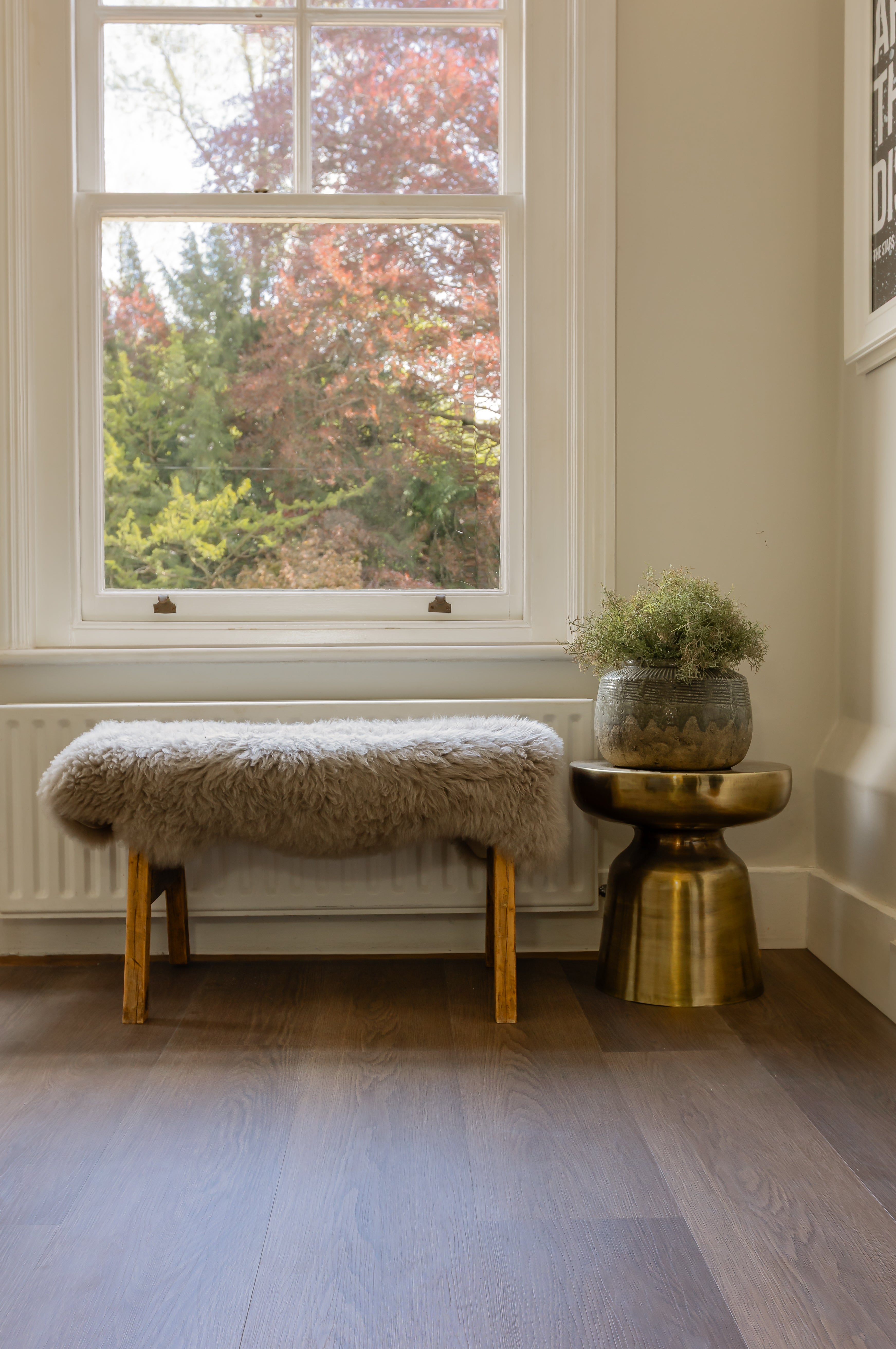 a dark brown rigid core vinyl floor with a bench seat on-top
