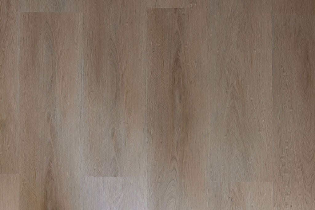close-up of a light and golden toned wood effect vinyl floor