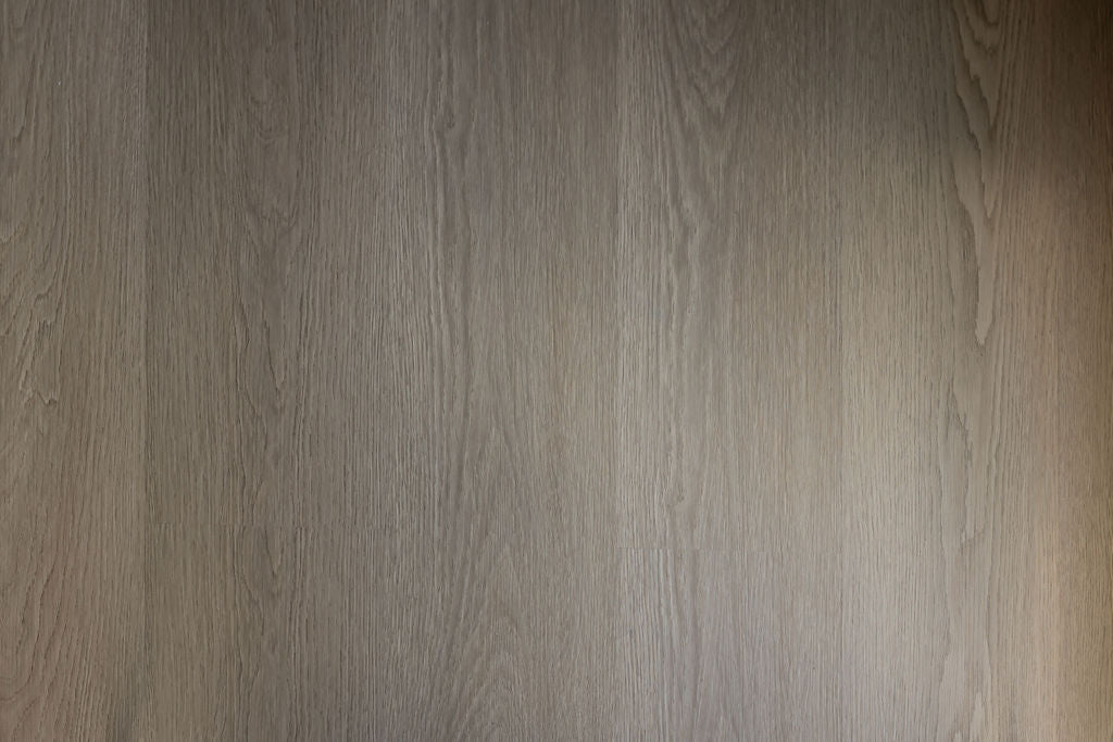 close-up of a wood effect SPC vinyl floor with natural warm grey and brown tones