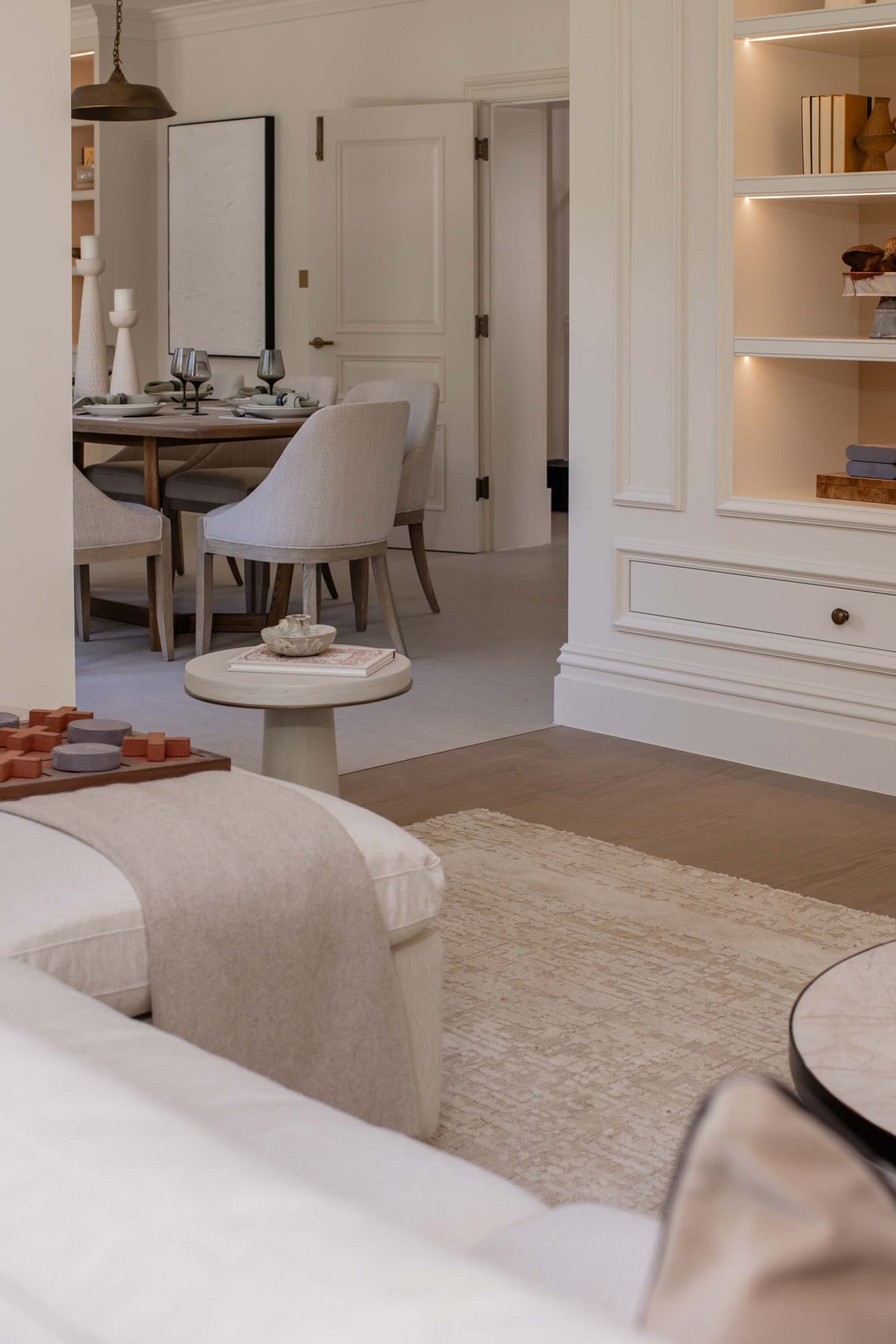 Modern living room with a sofa, coffee table, and decorative items.
