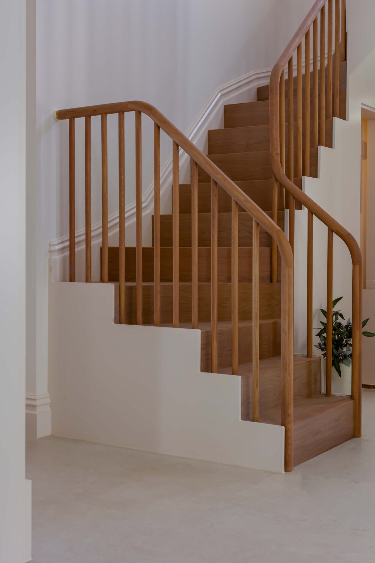 Staircase with engineered wood floor and wooden hand rails