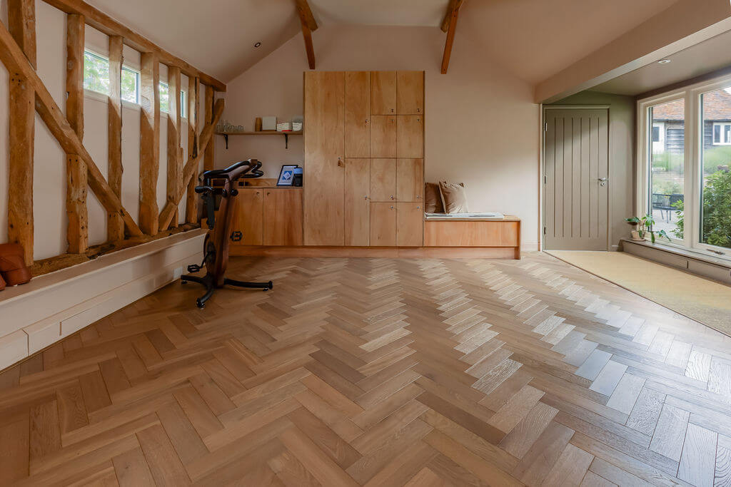 Private gym with herringbone wood floors