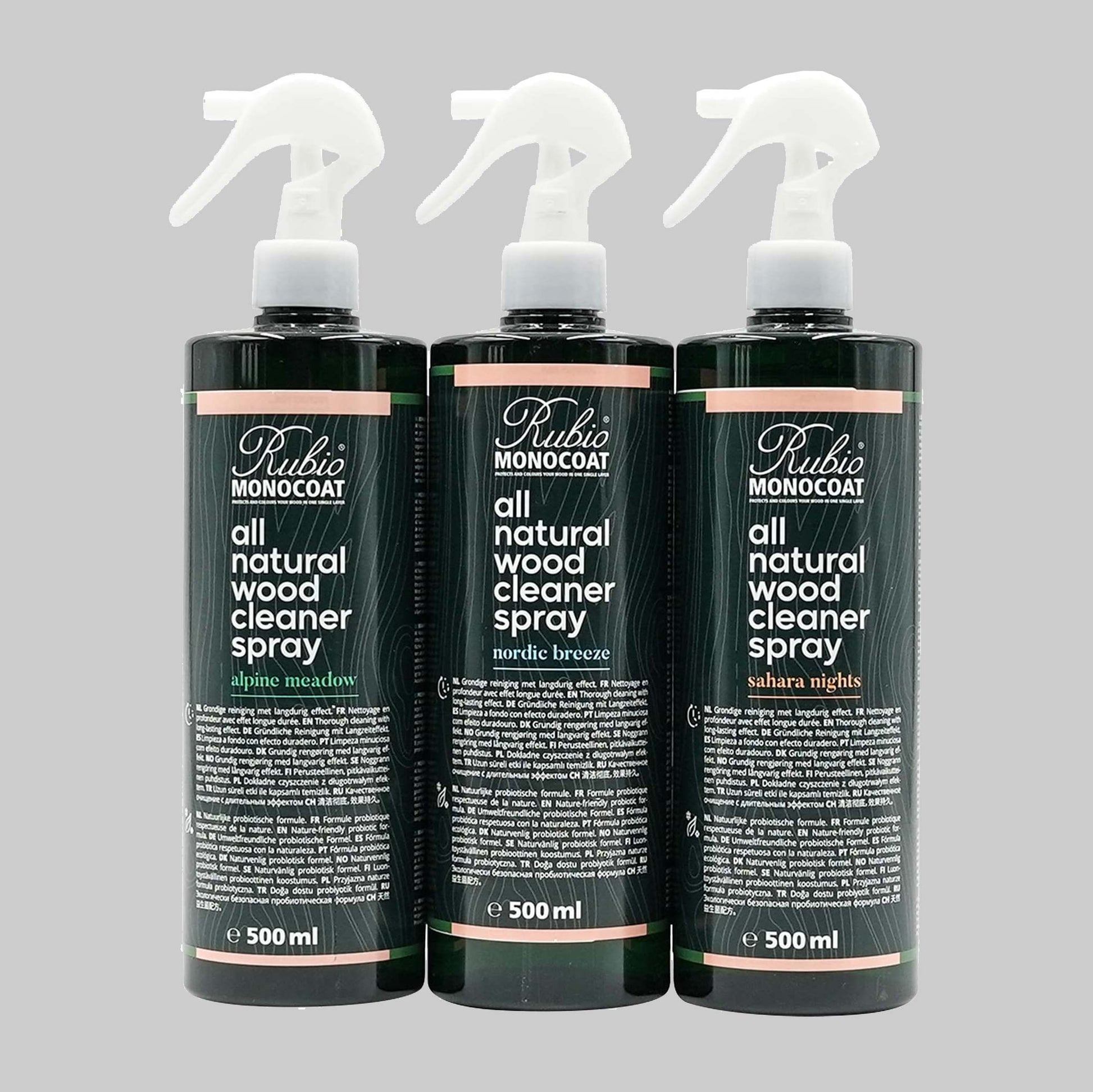 Three bottles of Rubio Monocoat all natural wood cleaner spray on a gray background