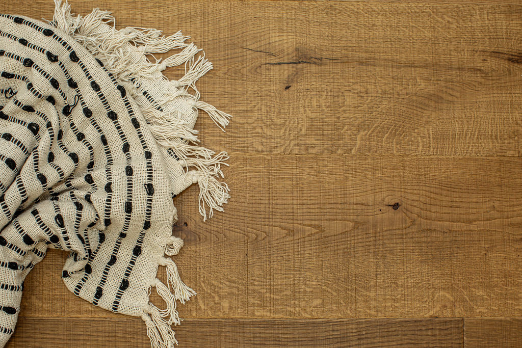 Textured throw sitting on Urban Nature Amberwood wood floors