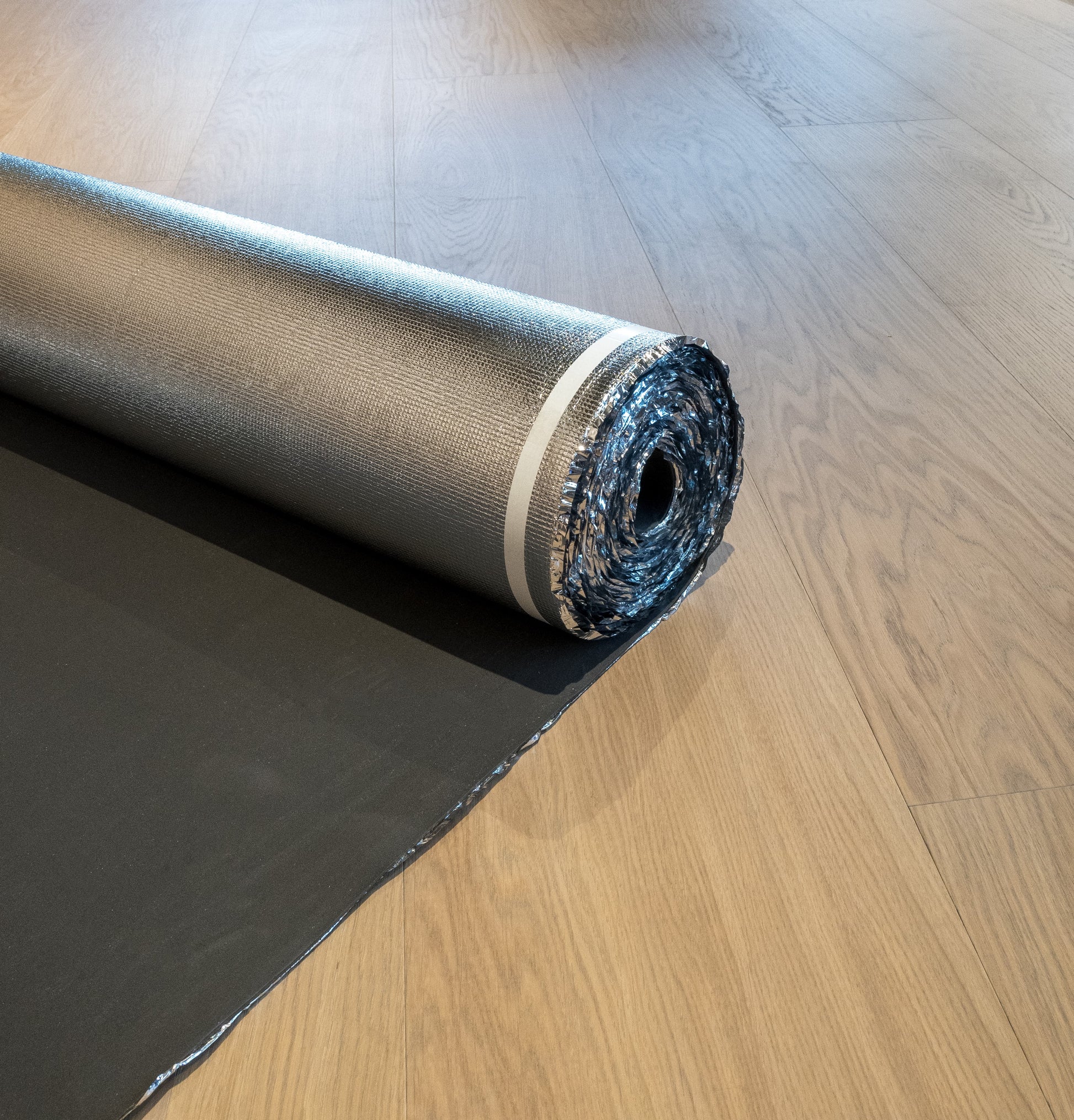 Roll of woods good underlay on a wooden floor