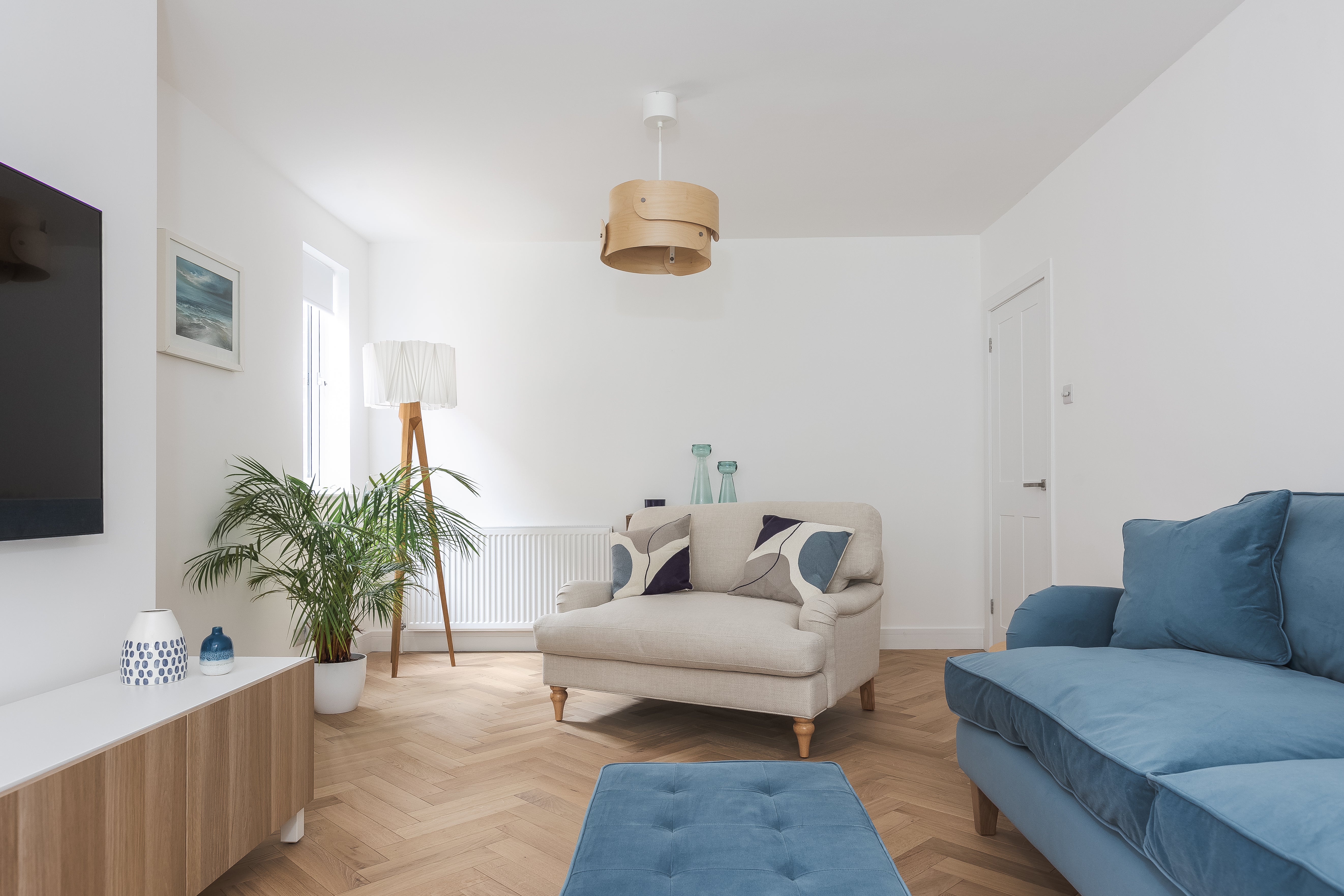 Deco Shore Drift Oak herringbone wood floors in a modern living room
