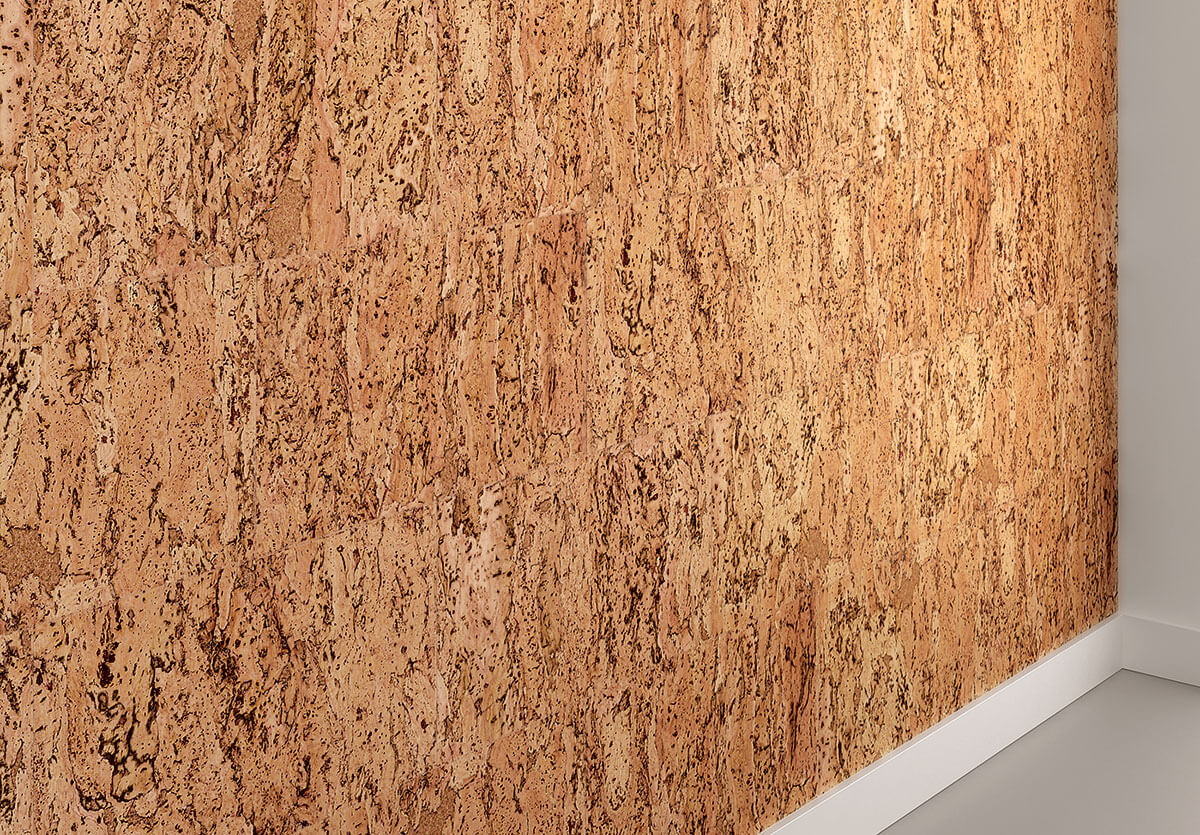 Cork wall paneling on a wall with a white baseboard.