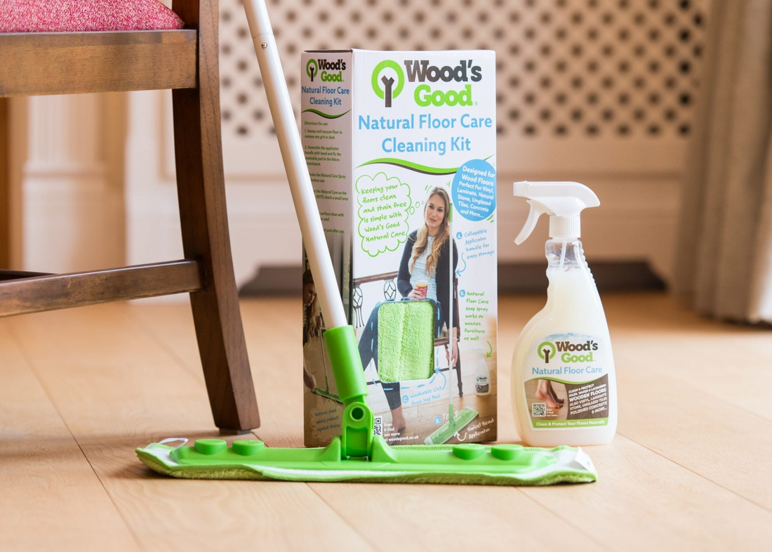 Wood's Good natural floor care cleaning kit with mop and spray bottle on a wooden floor.