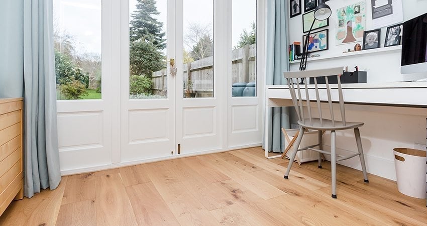 large light oak wood floors in a small office space with natural light