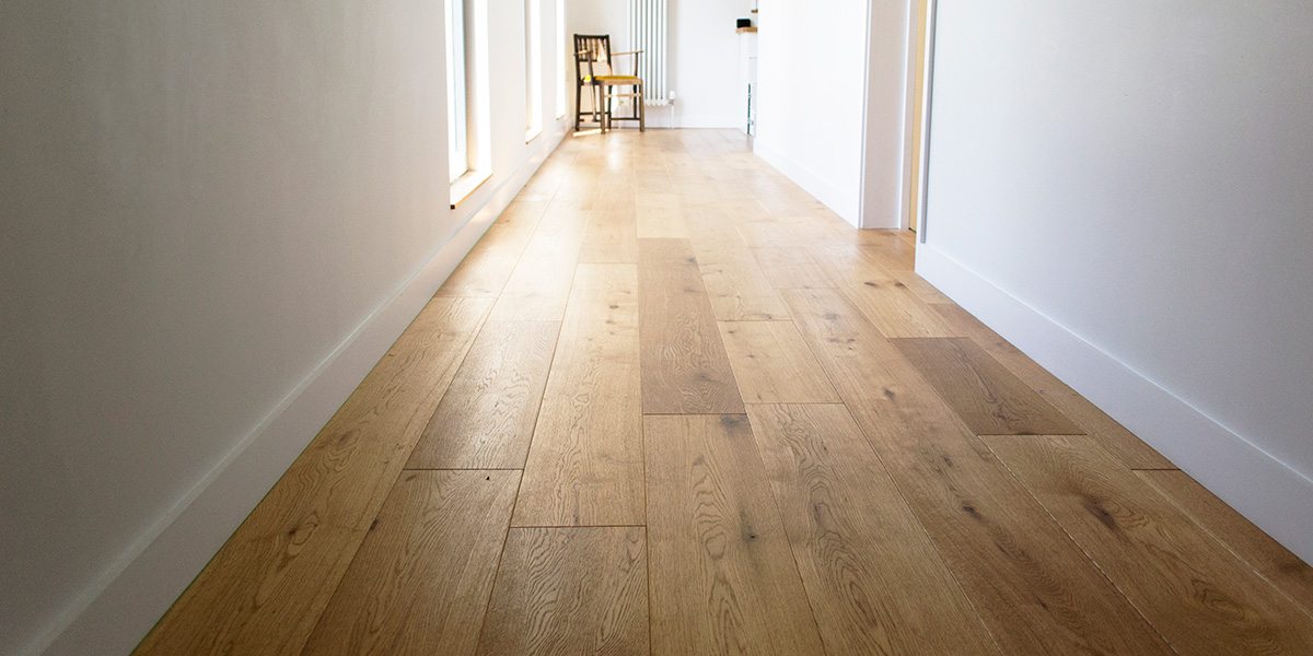 brushed oil oak wood flooring in a long hallway