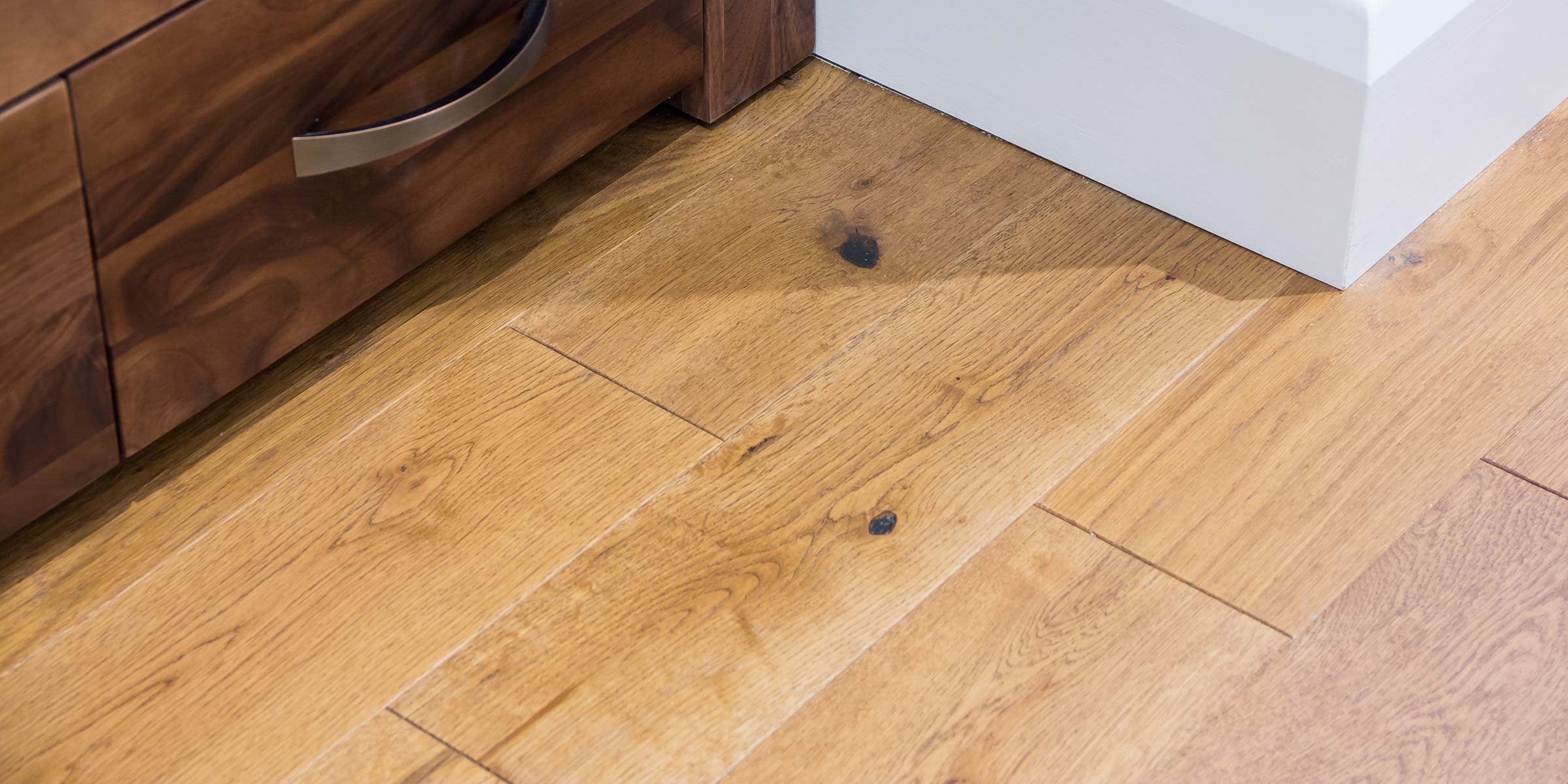 close up of golden stained oak wood floorboards