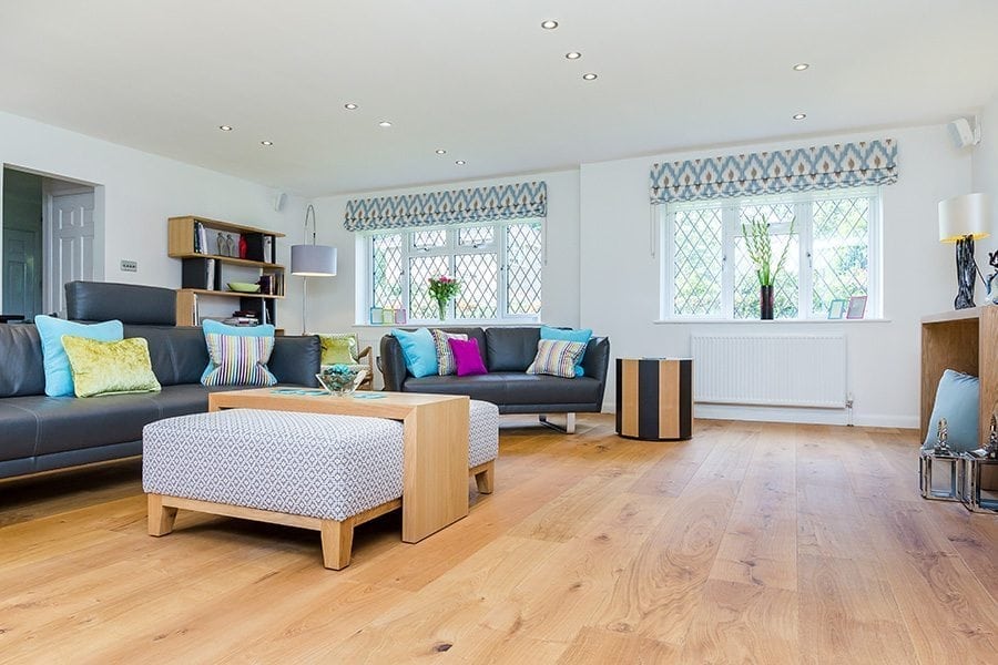 natural oak floors with modern, colourful furnishings in a living room