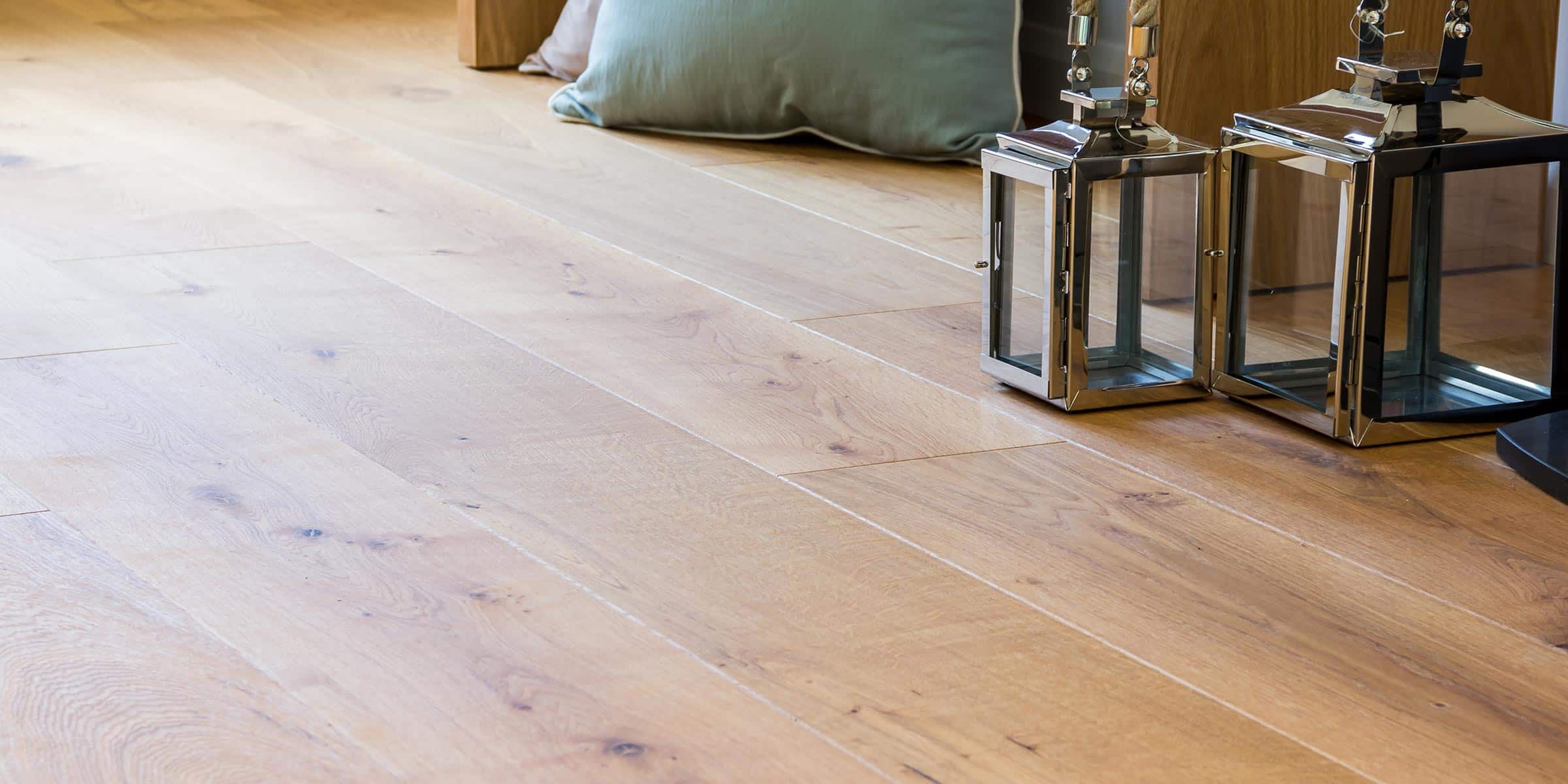 natural oak wood floor with metal lantern accessories on the right hand side