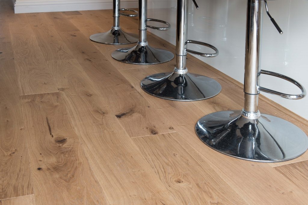 metallic bar stools on hard wood flooring