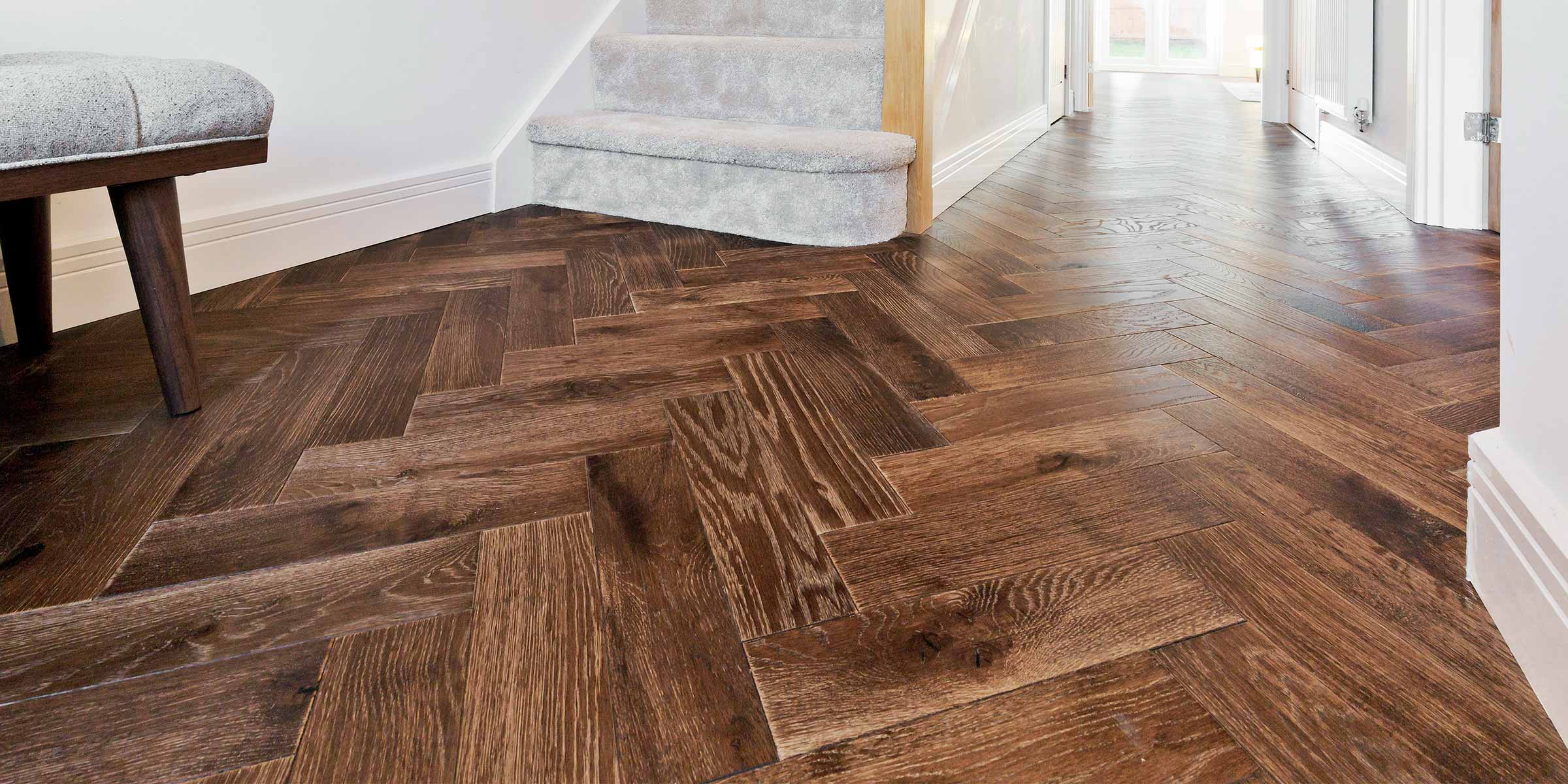 close up of dark wood herringbone flooring