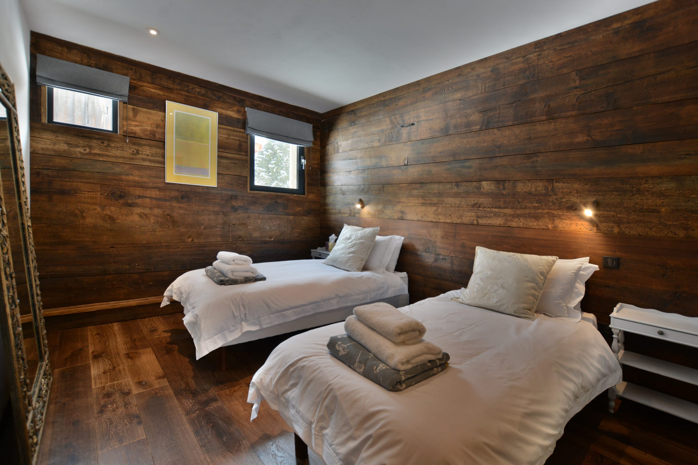 bedroom with dark wood floor and wall panelling