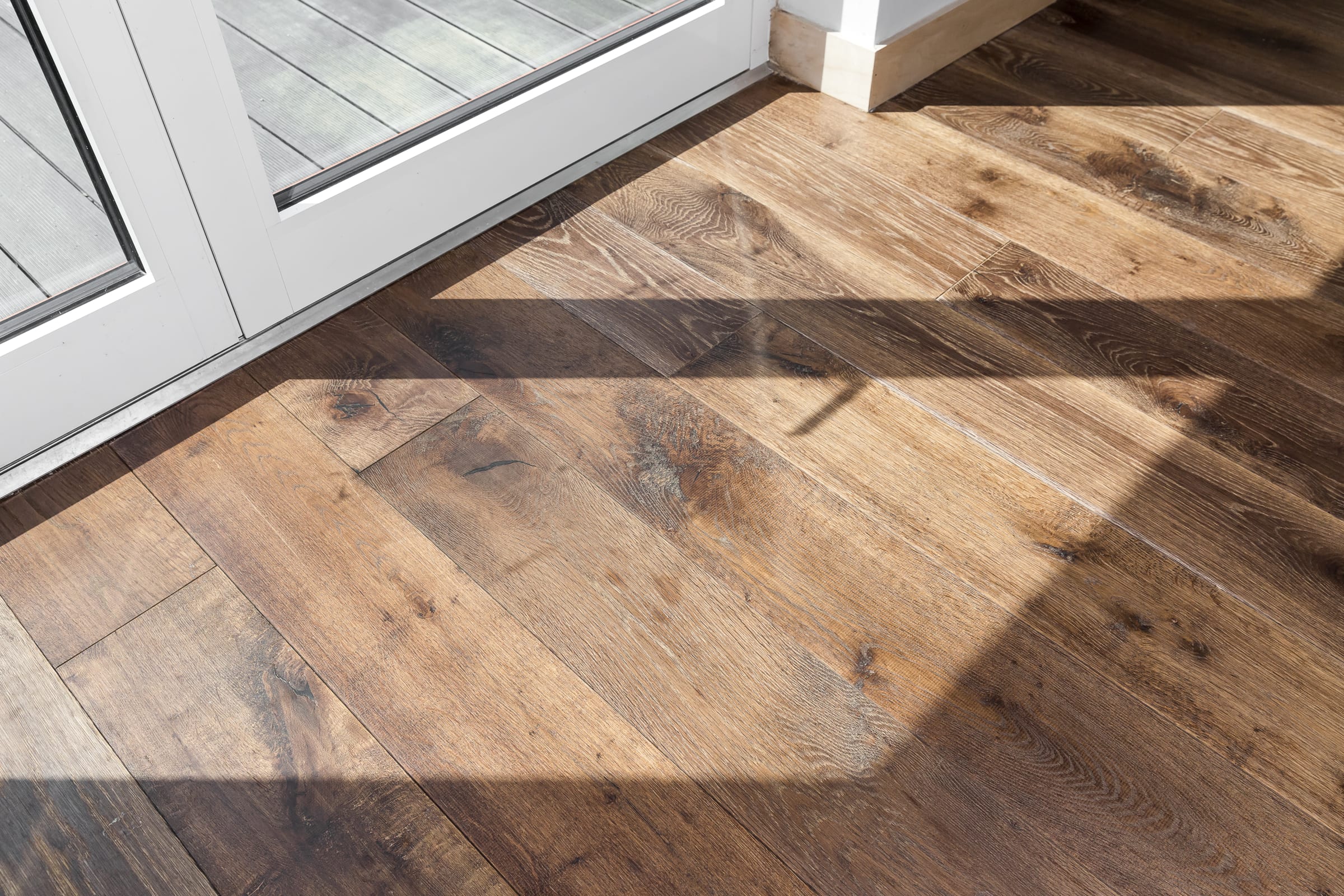 close up of dark wood flooring in a sunny patch of light