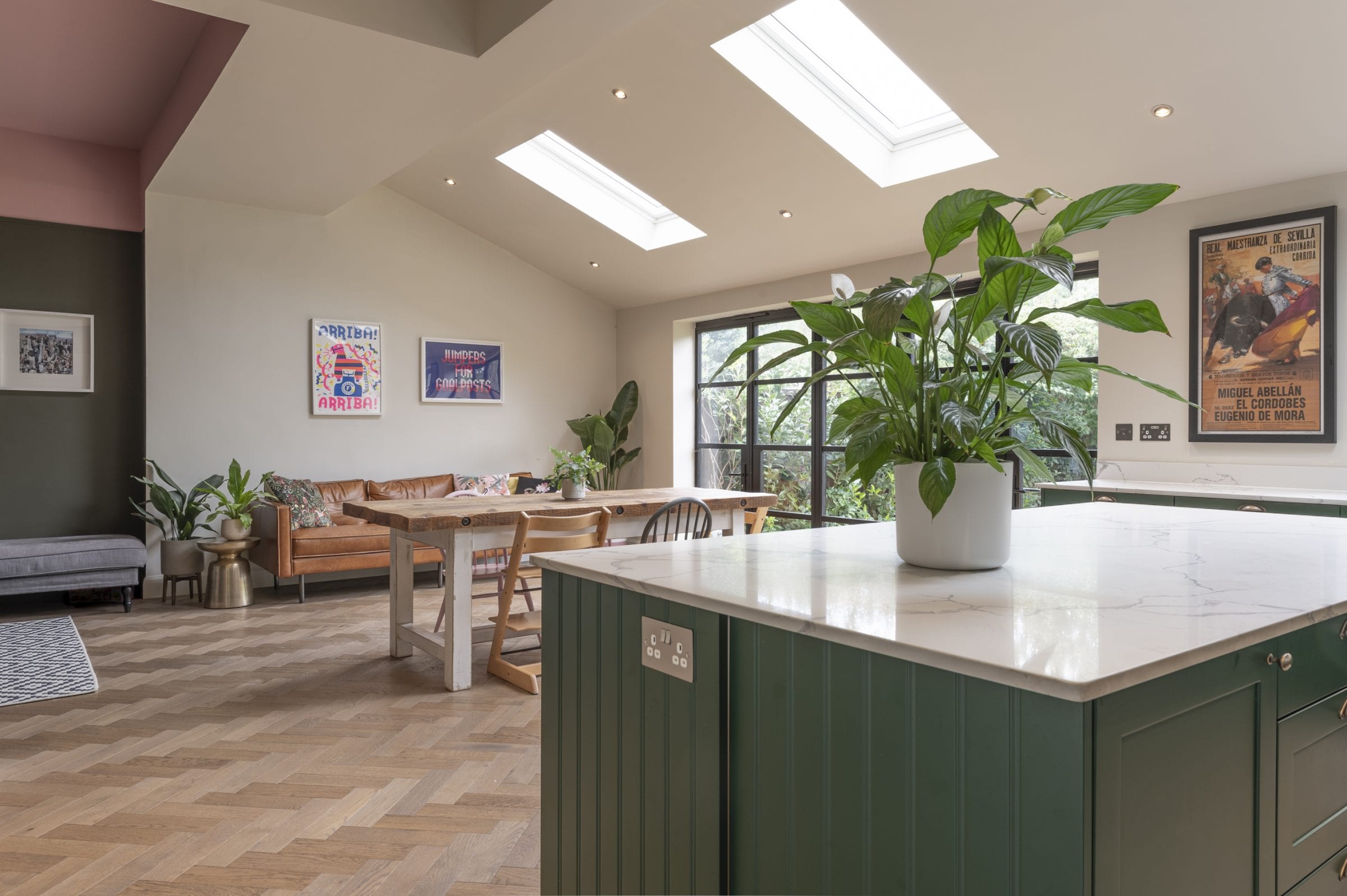 green kitchen with herringbone floors