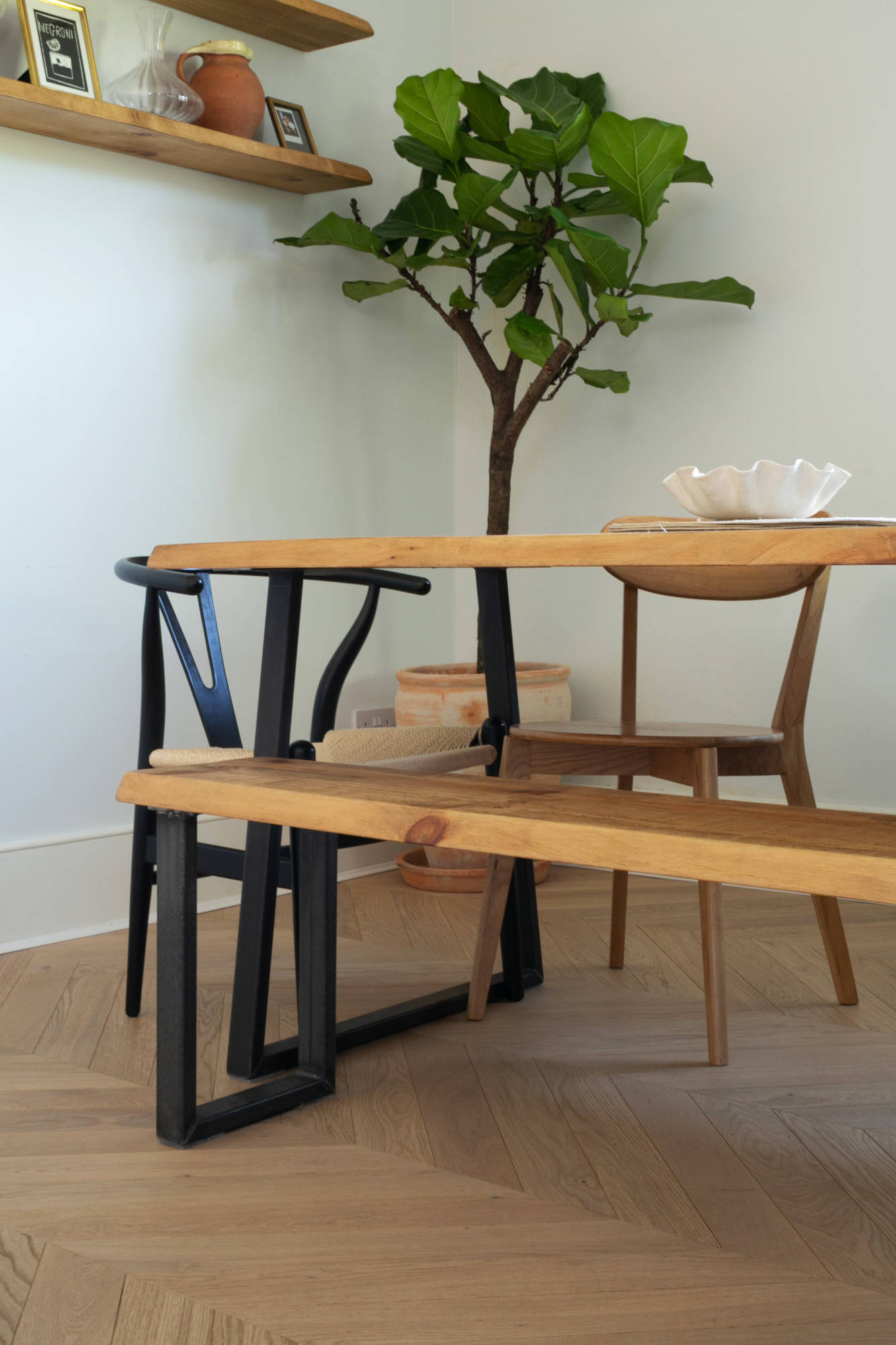 light airy room with a plant and oak furniture