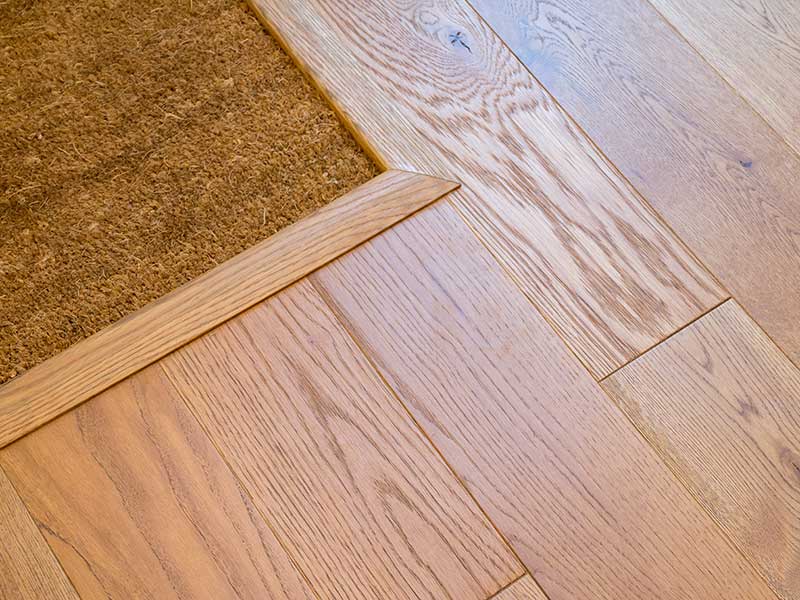 oak floors with an oak transition to the doormat