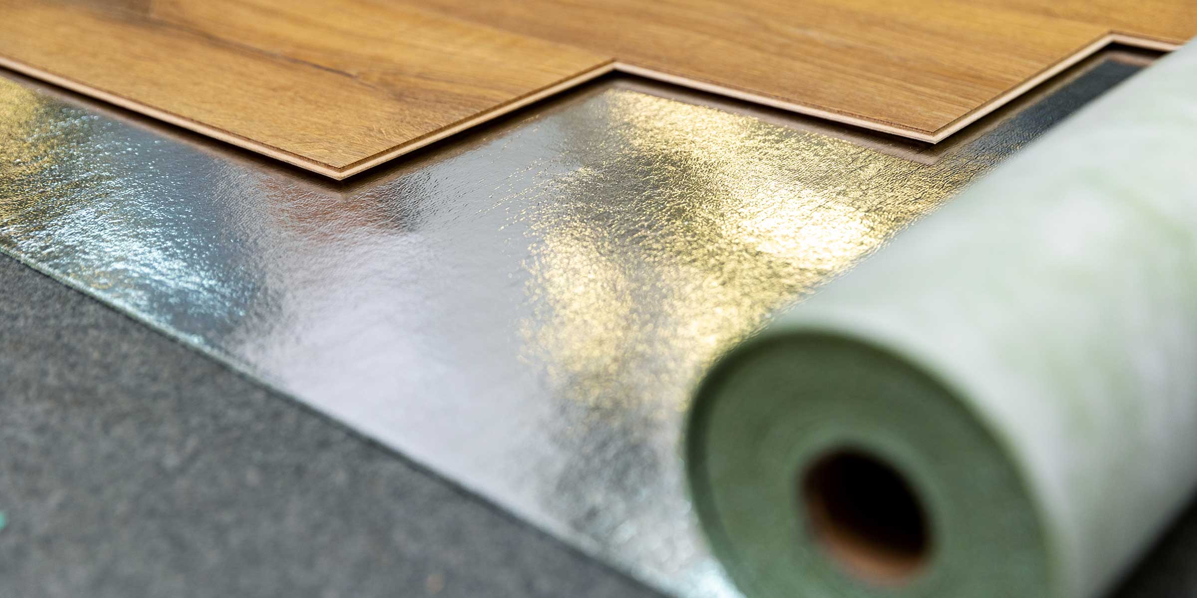 specialist metallic underlay, with a portion of wood floor on top