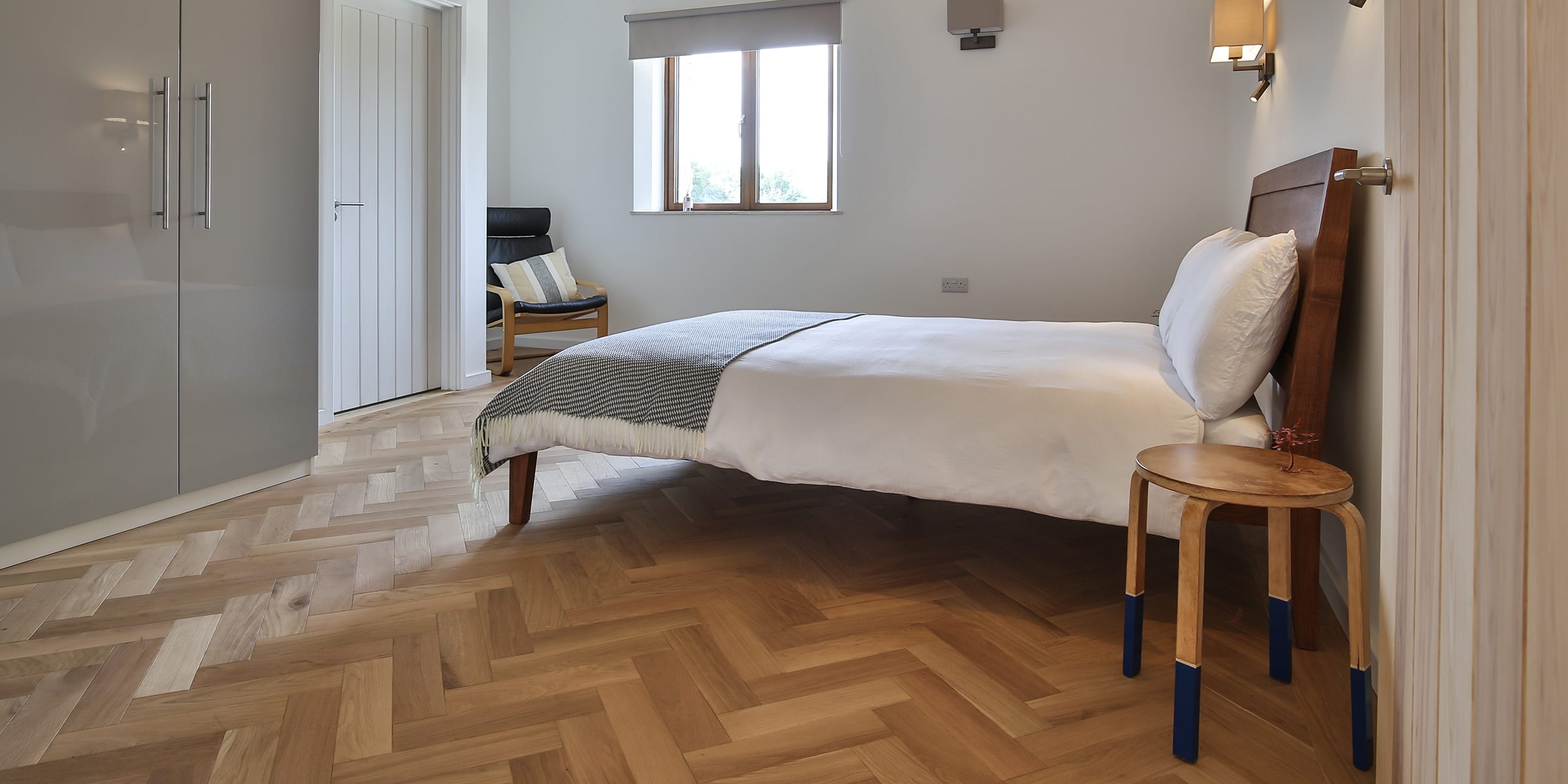 natural oak herringbone in a bedroom