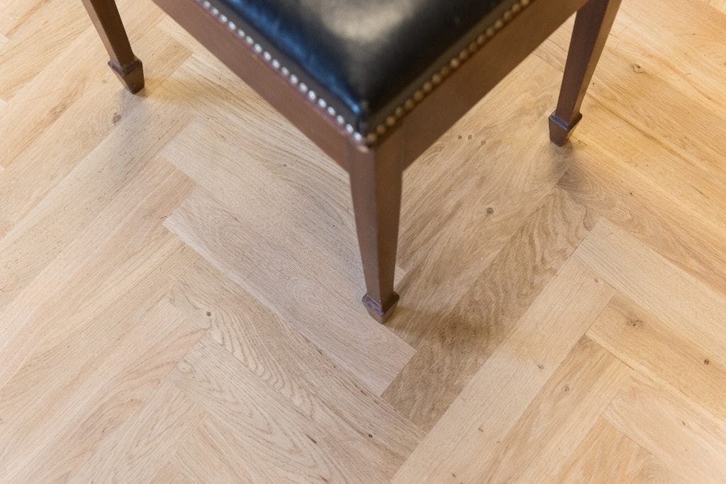 close up of a bench on solid oak parquet floors