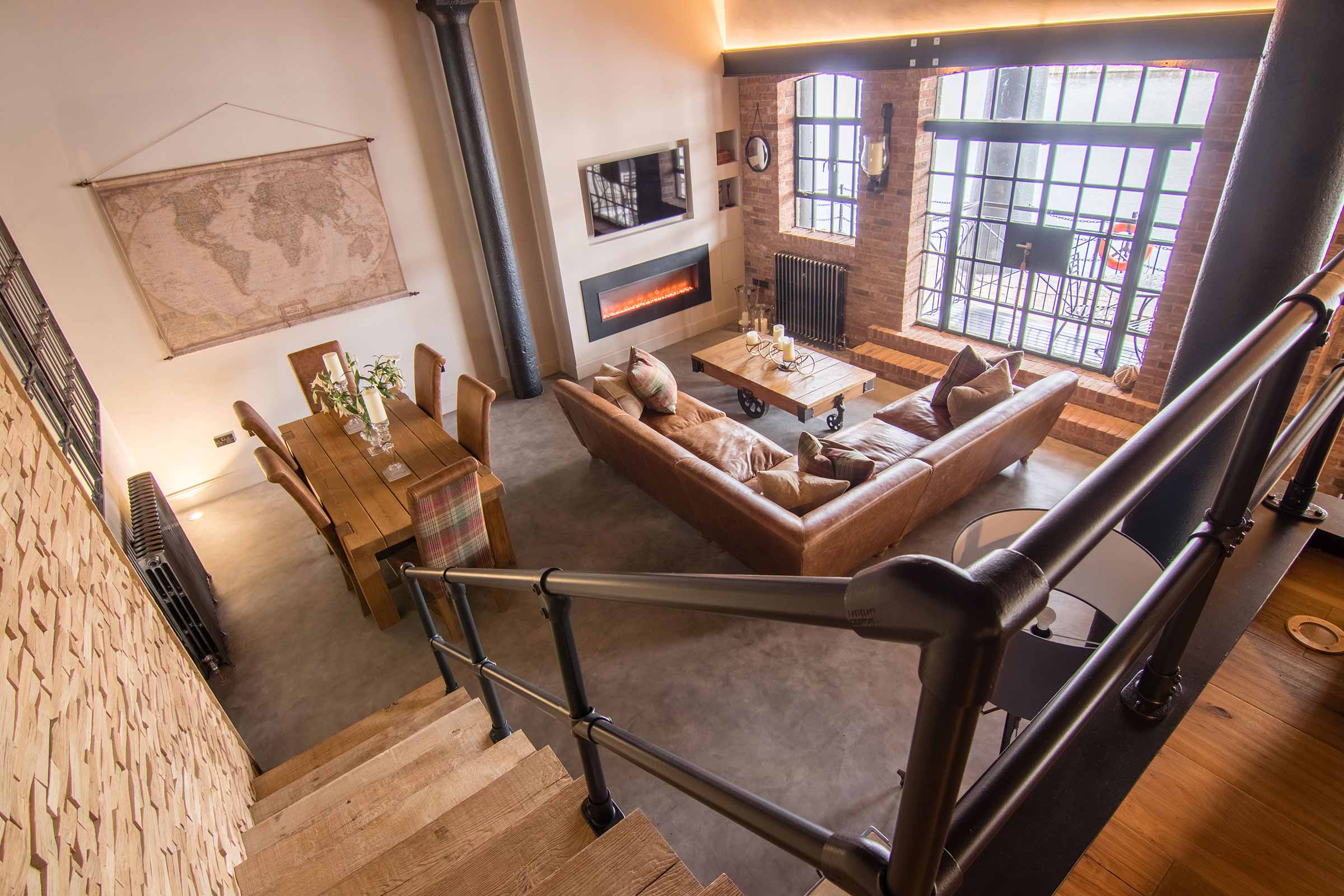 view down the stairs featuring cracked oak wood