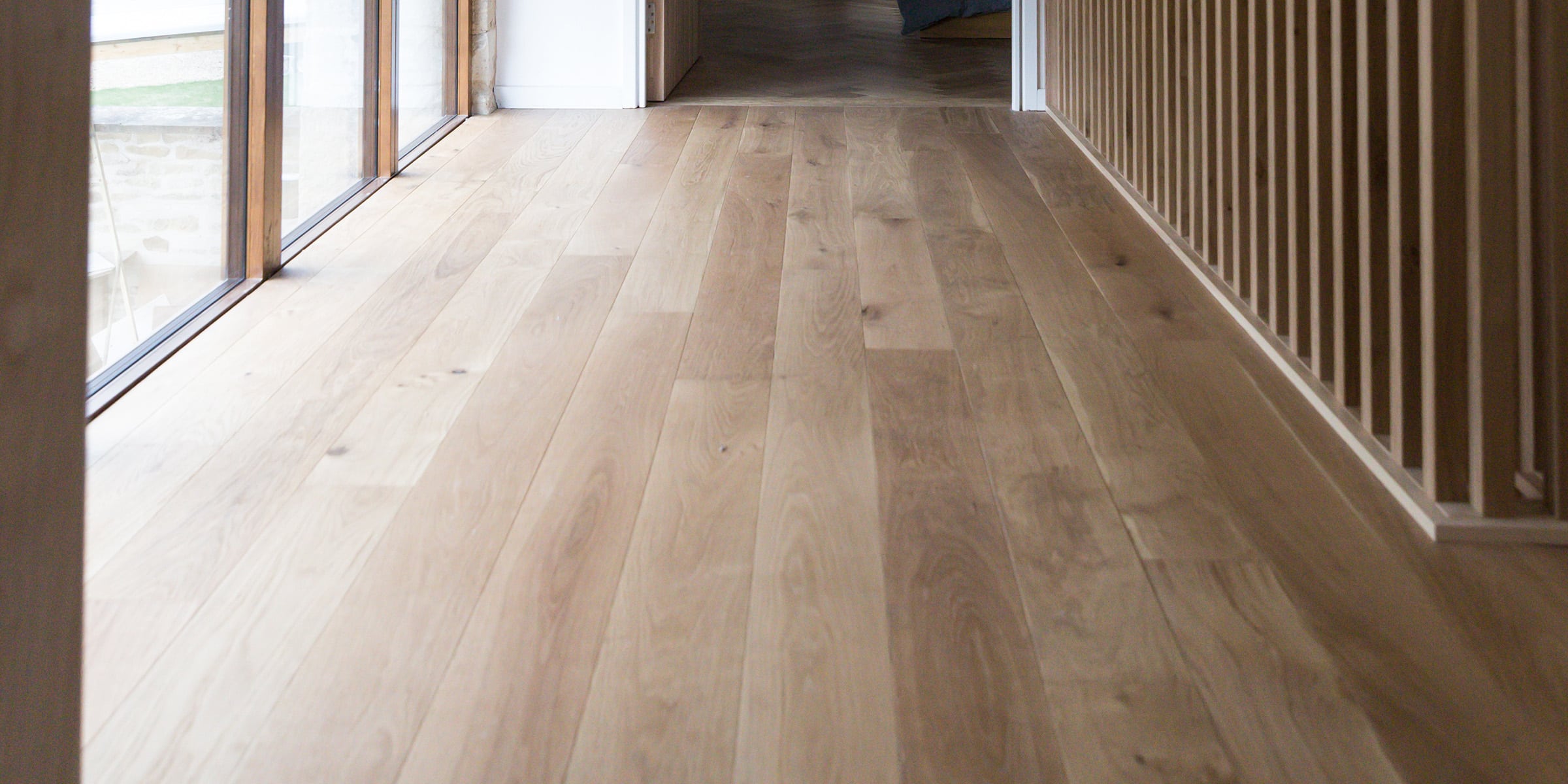 close up of natural oak wood flooring in a hallway