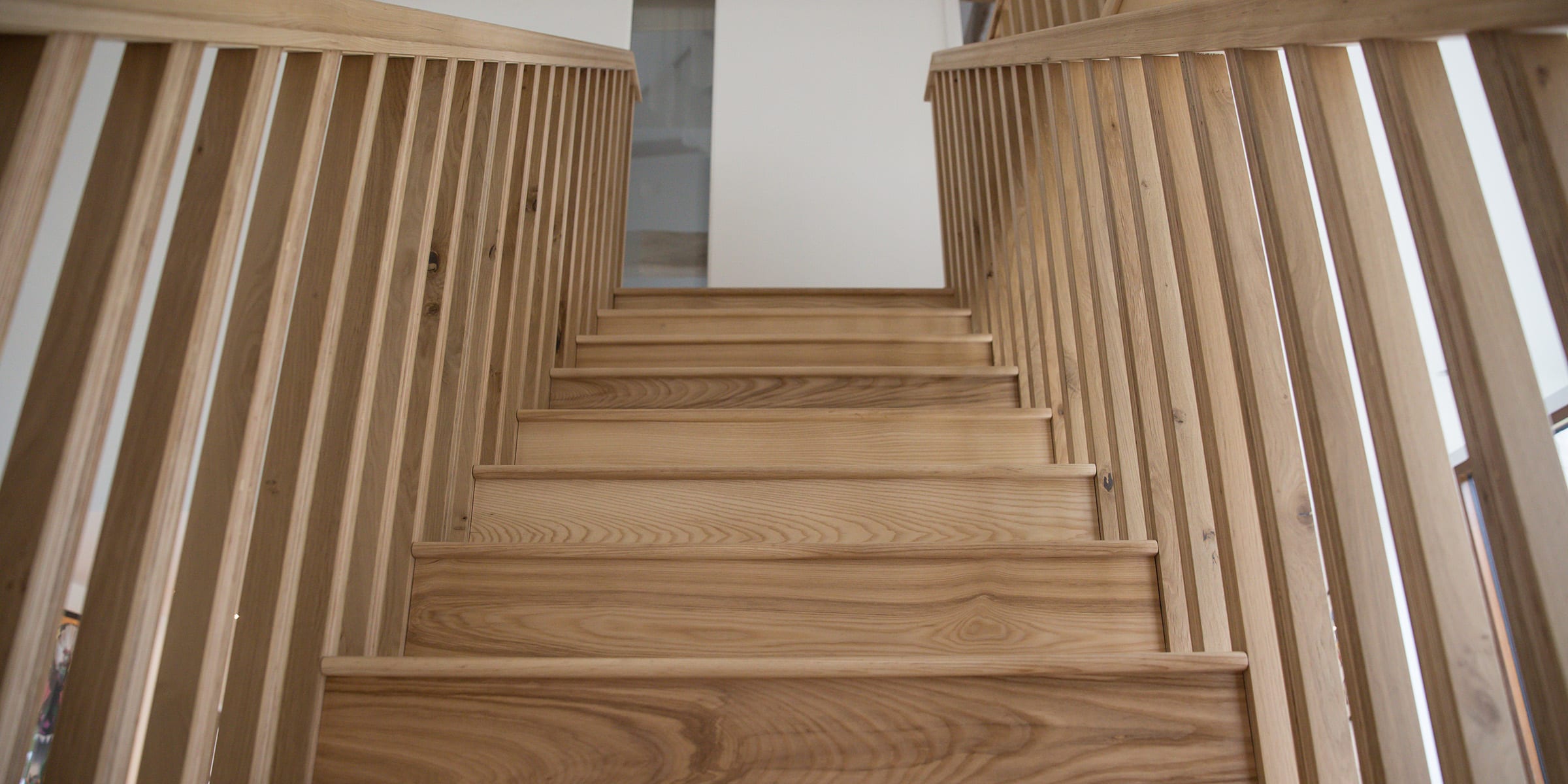 natural oak wood stair case and railings