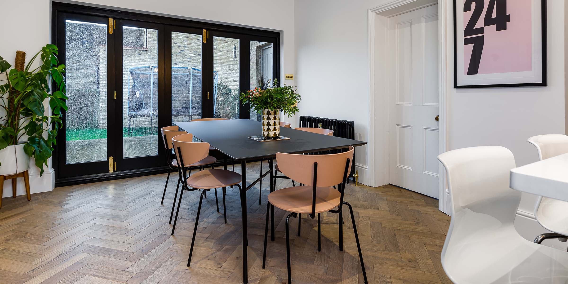 herringbone wood floor in a stylish dining room