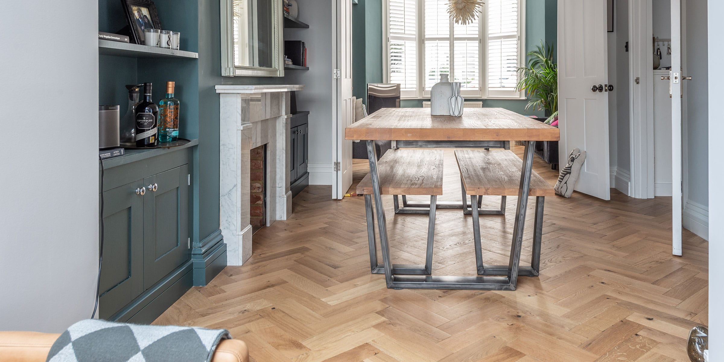 herringbone wood flooring in a stylish flat