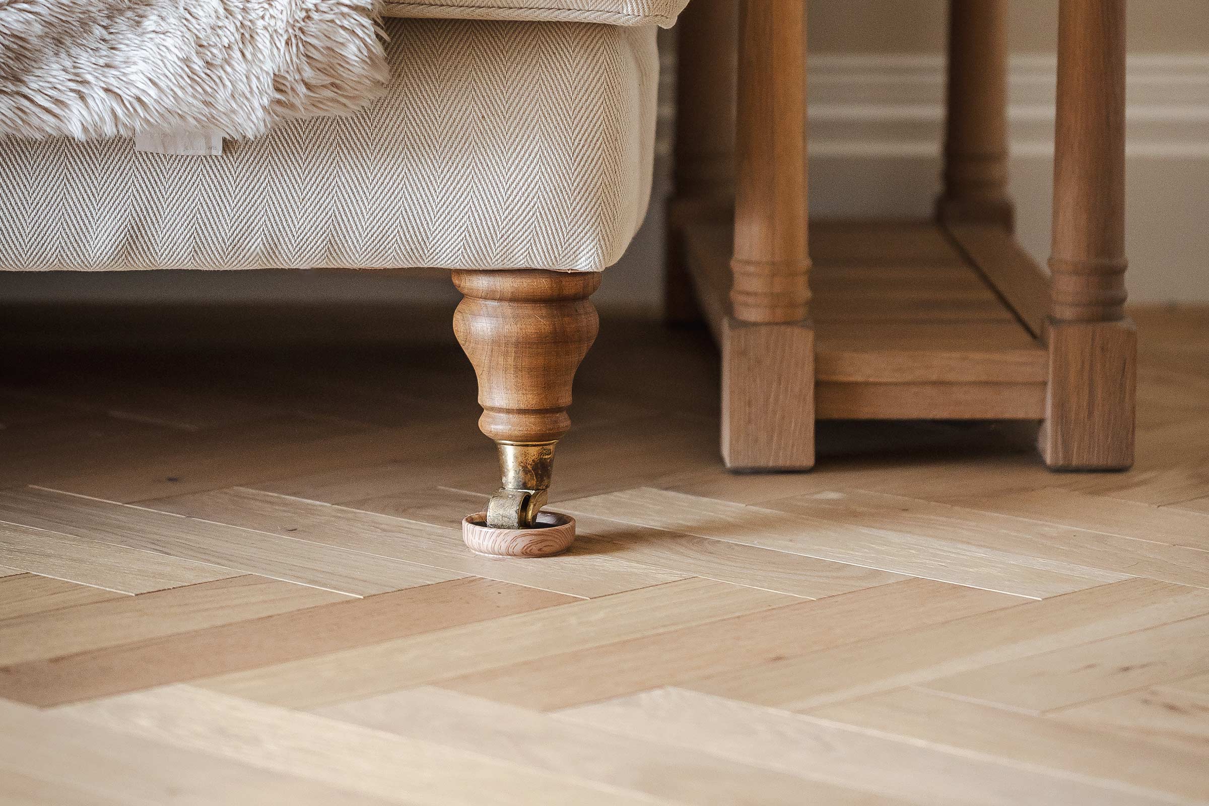 close up of light wood herringbone flooring