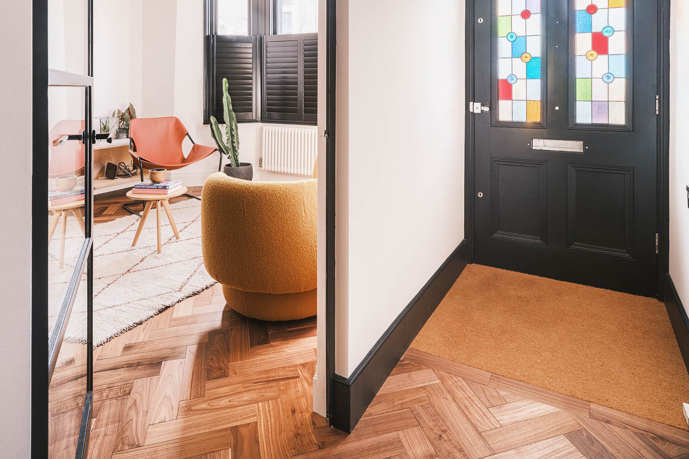 herringbone wood floors in a light hallway