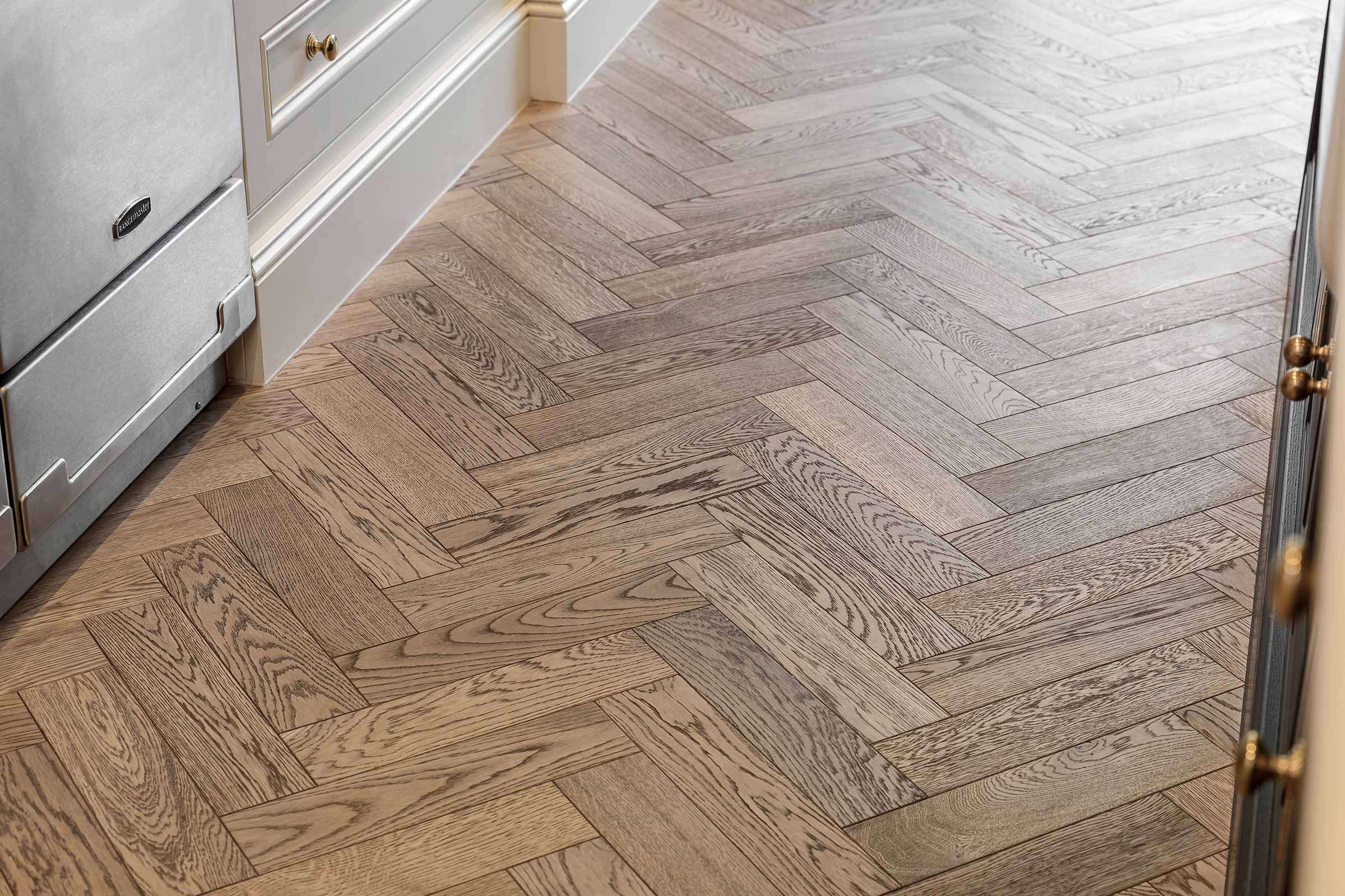 close up of herringbone wood floors