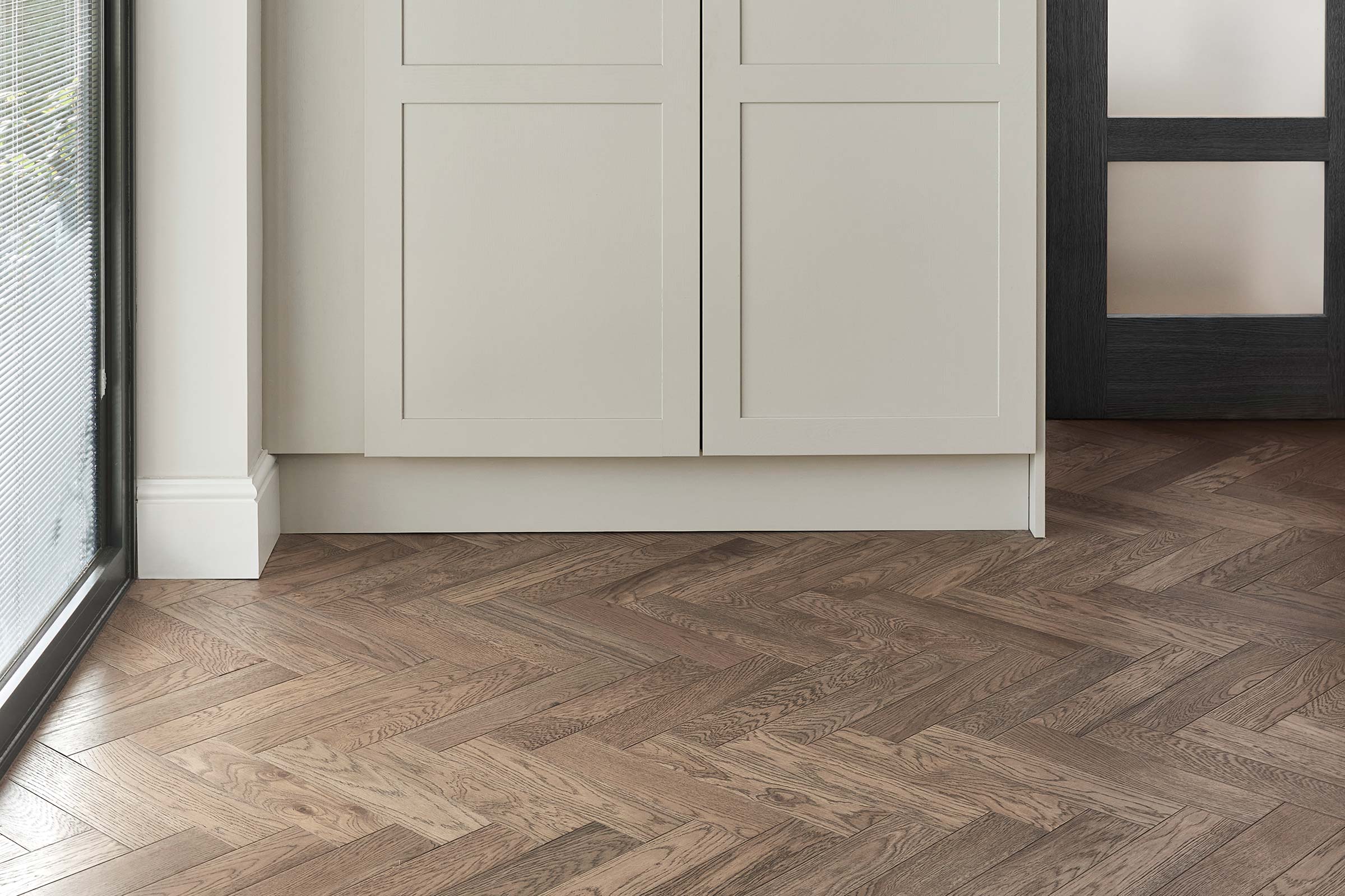 close up of herringbone wood floors