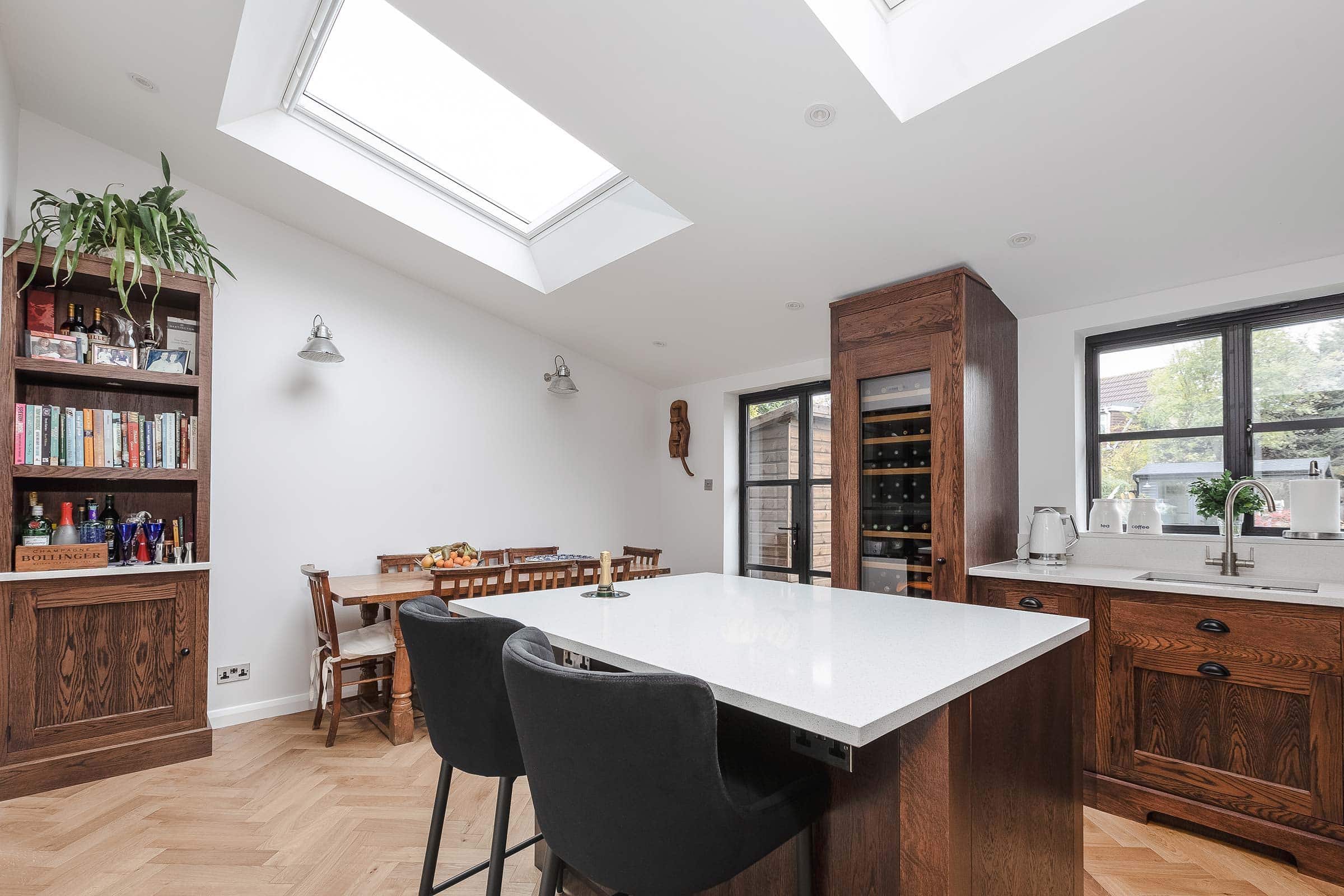 herringbone floors in a modern wooden kitchen with skylights