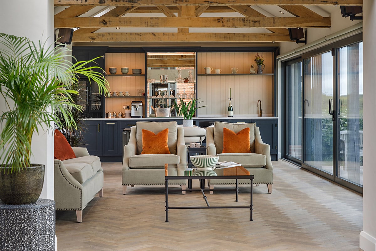 a living room with wooden floors and sofa and coffee table